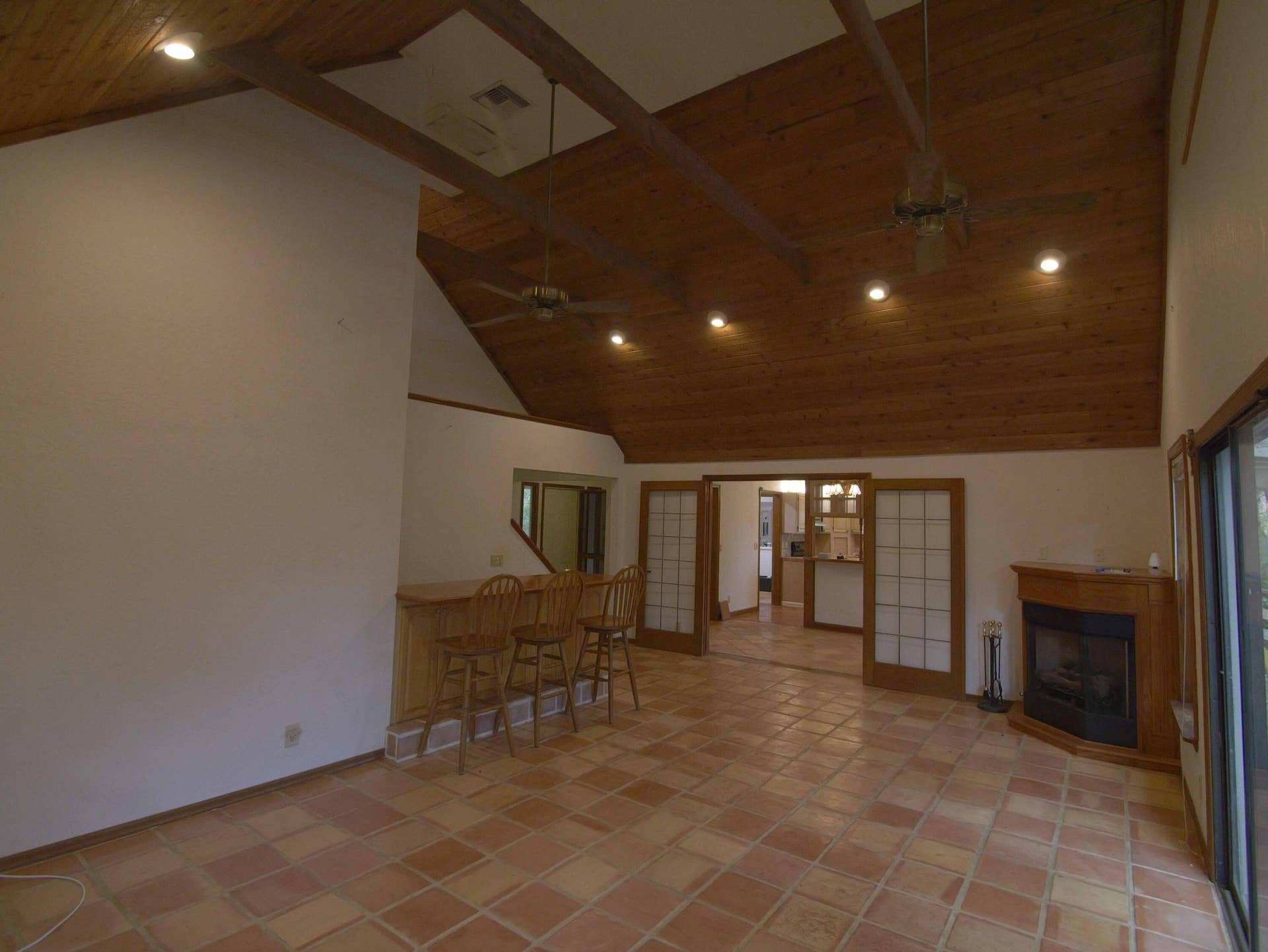 17032 130TH Avenue N, Jupiter, FL 33478 Great Room looking at fireplace & French doors & Kitchen