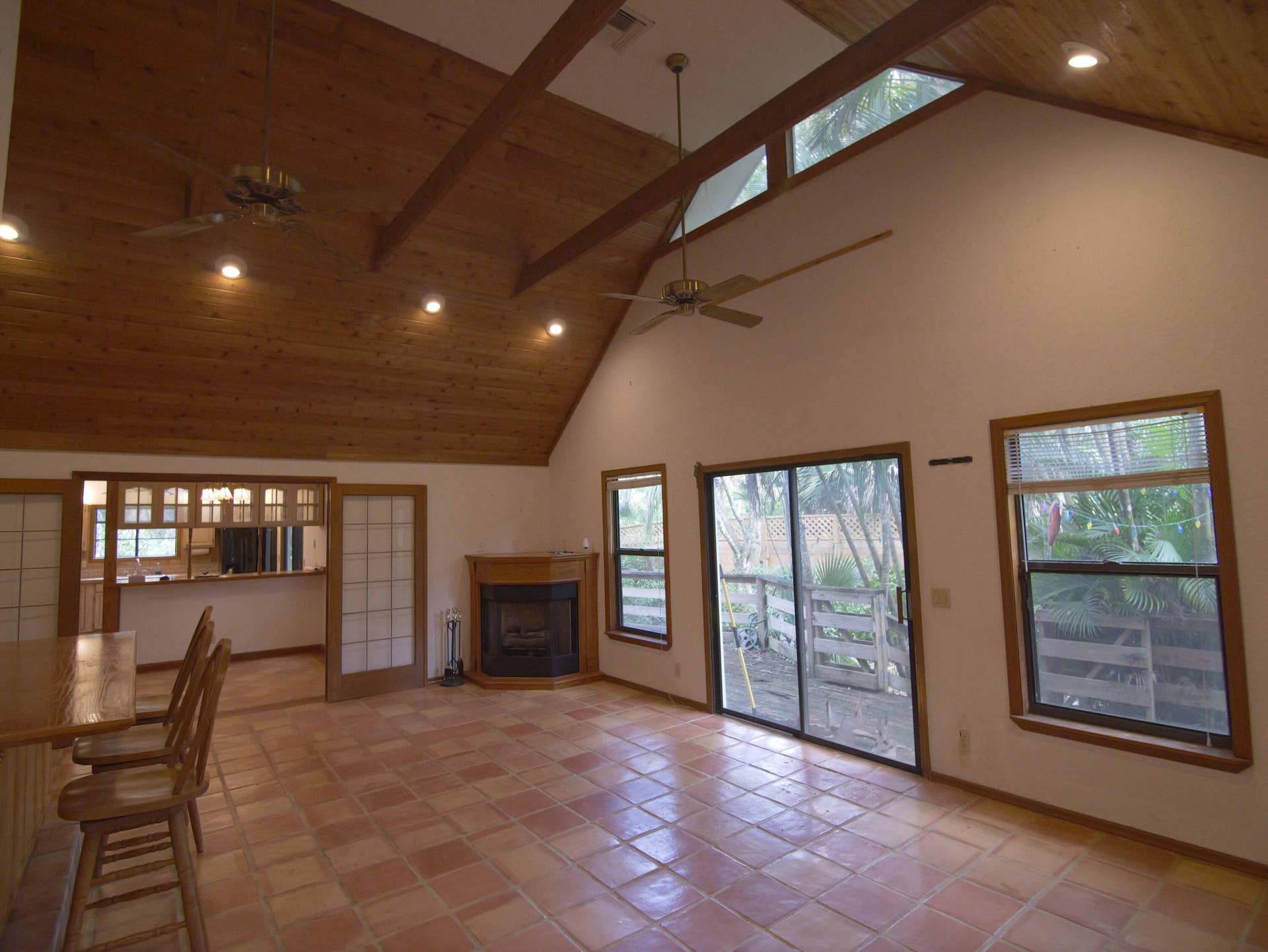 17032 130TH Avenue N, Jupiter, FL 33478 Great Room w/ French doors, fireplace & wrap around deck