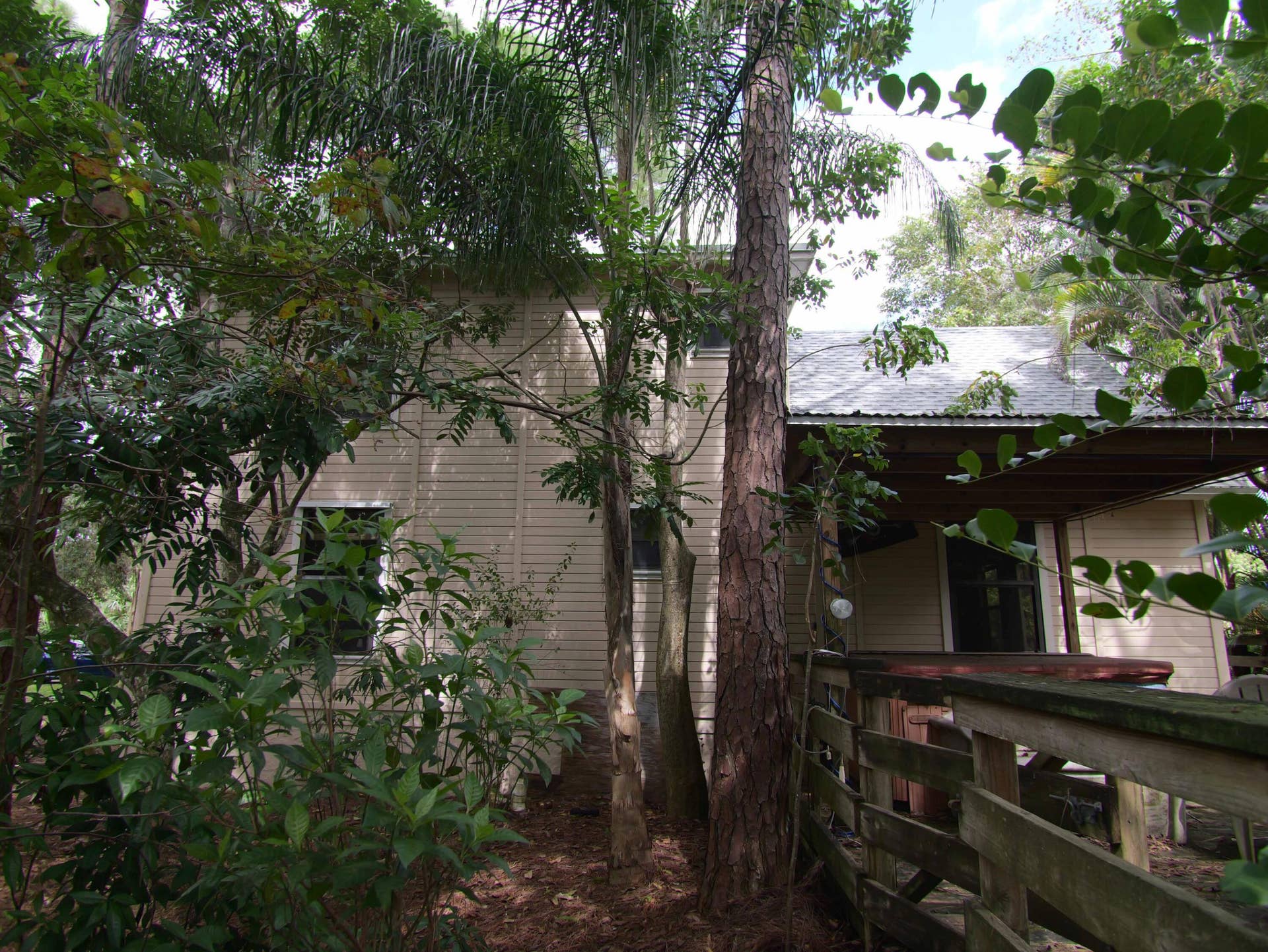 17032 130TH Avenue N, Jupiter, FL 33478 South Side showing Hot tub & deck