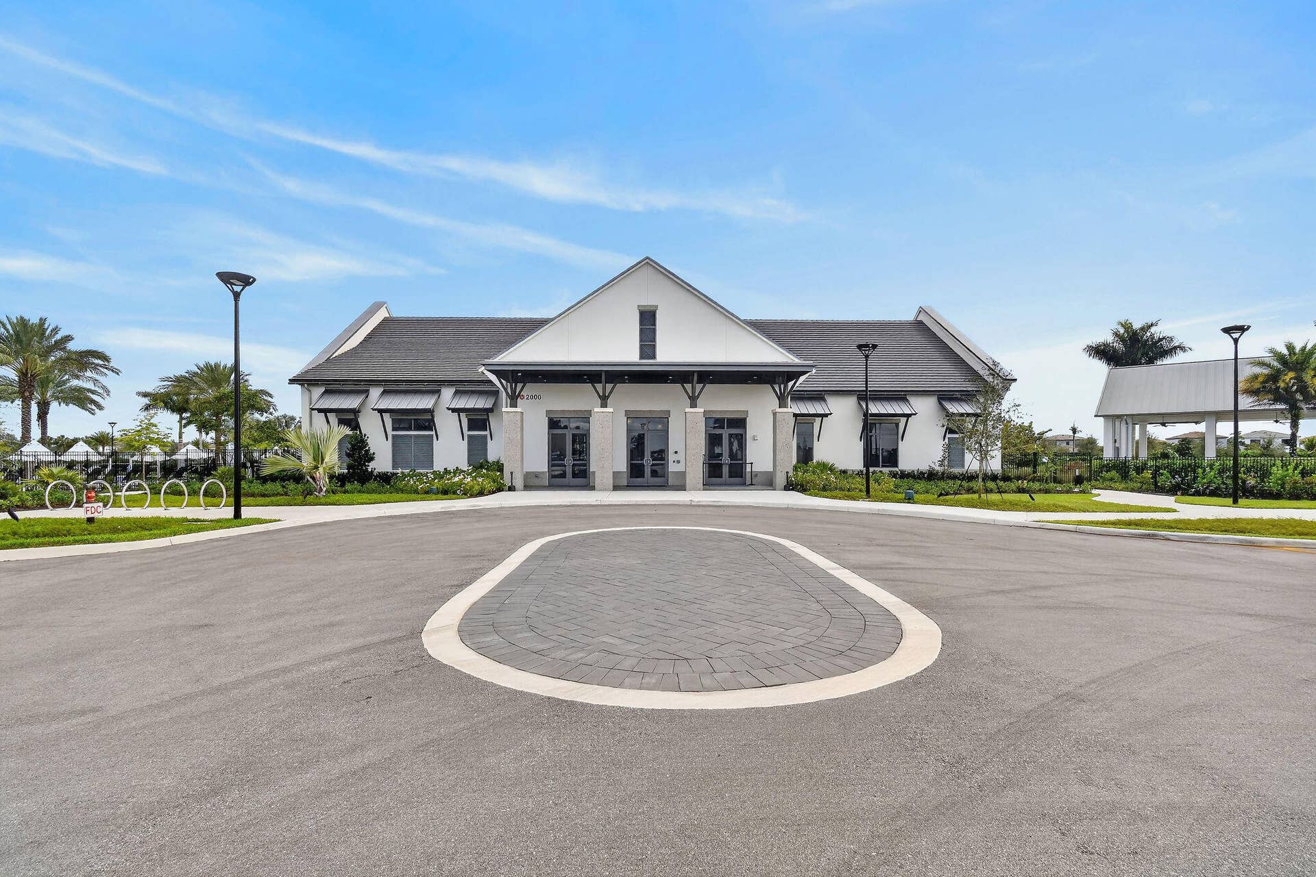 15811 Key Biscayne Lane, Westlake, FL 33470 Architectural building with gabled roofline and covered entryway