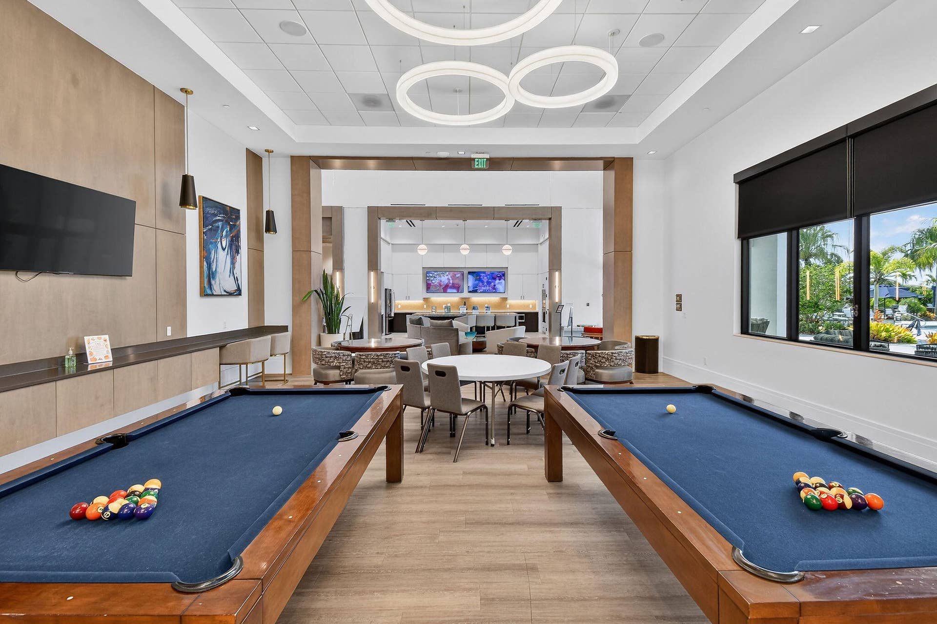 15811 Key Biscayne Lane, Westlake, FL 33470 Recreation room featuring two pool tables and wood-finish flooring