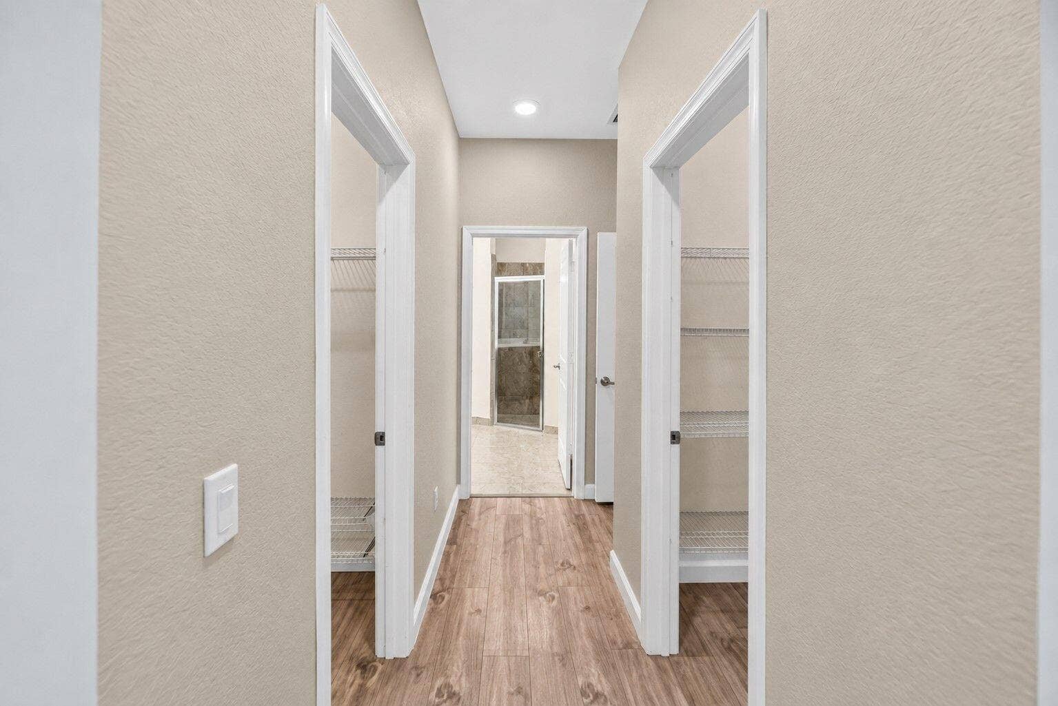 8410 NW GREENBANK Circle, Port St Lucie, FL 34987 36-web-or-mls-Primary bedroom Hallway