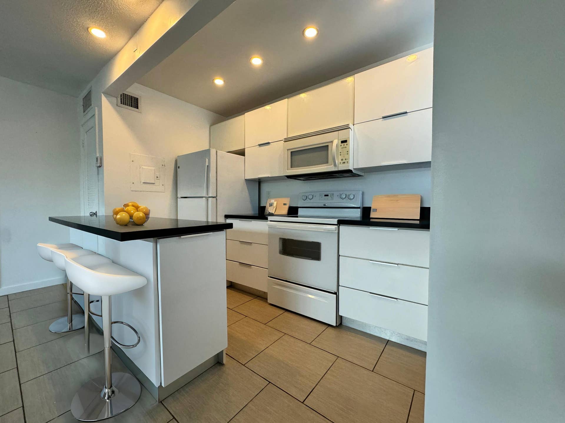 2830 NE 30th Street, #9, Fort Lauderdale, FL 33306 AI - Staged Kitchen side view 2