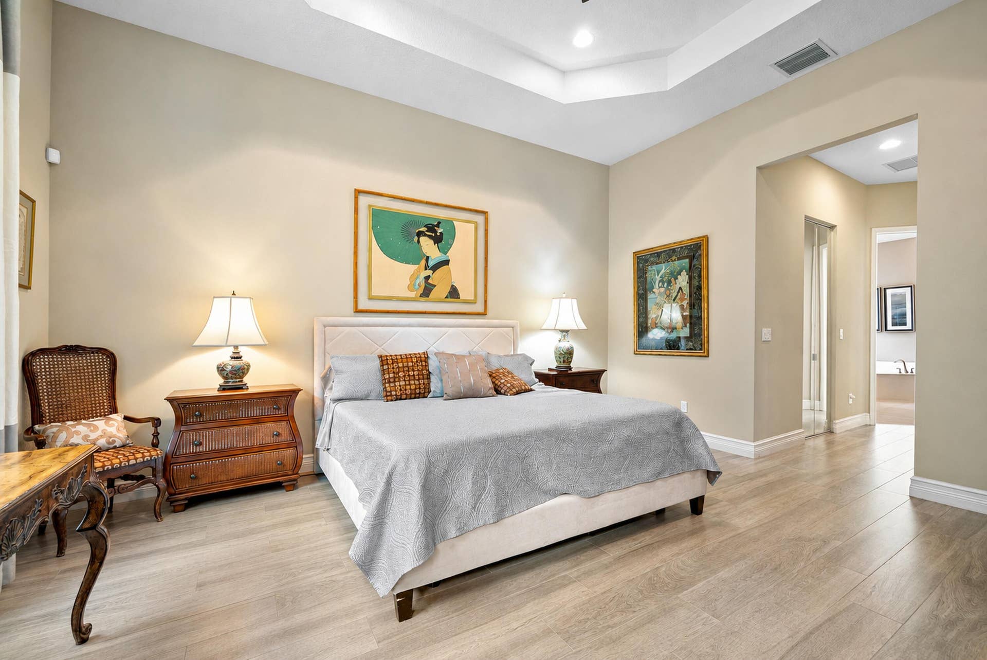 Tray ceiling, recessed lighting, and wood-finish flooring
