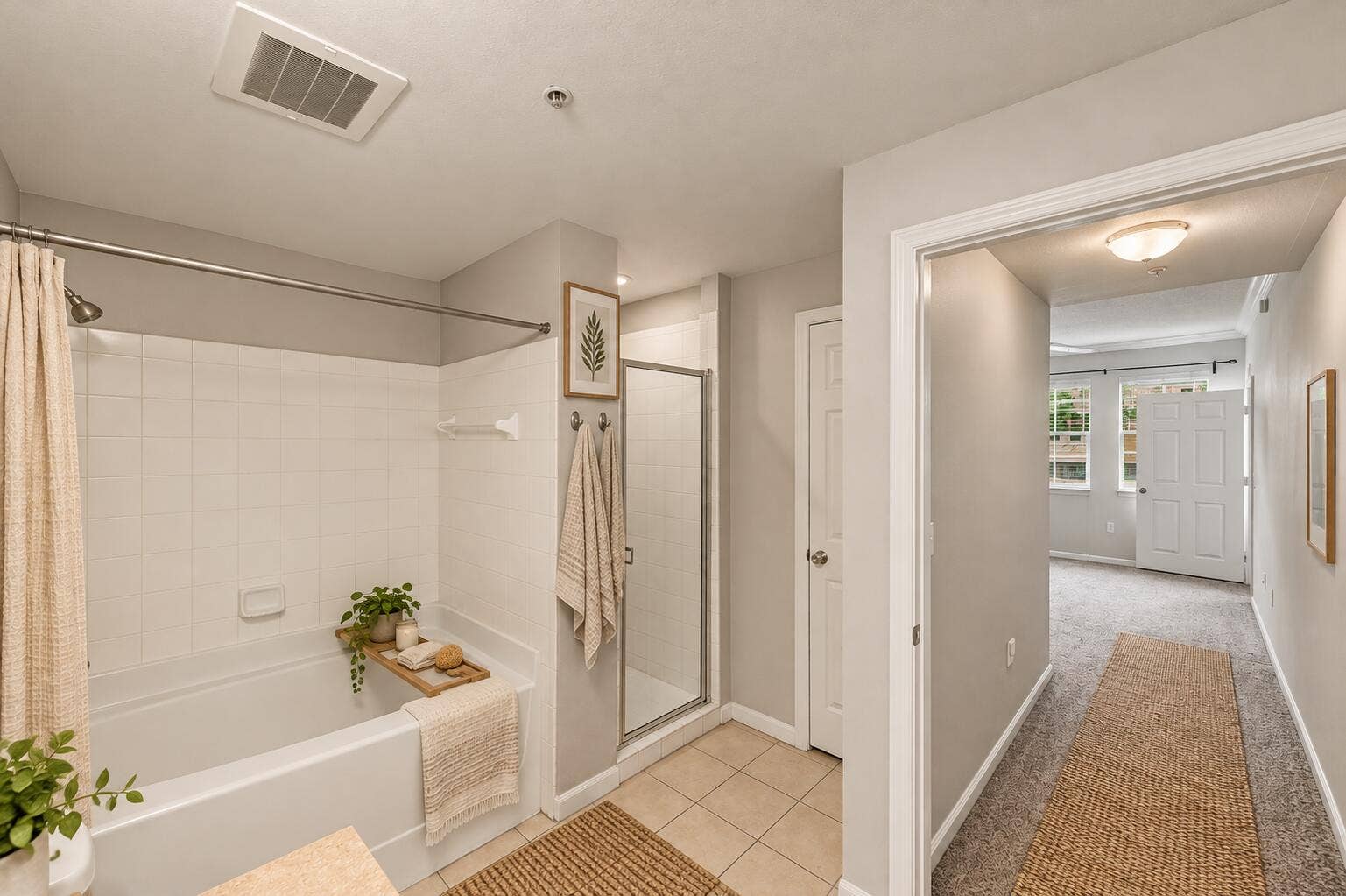 533 NE 3RD Avenue, #202, Fort Lauderdale, FL 33301 Bathroom featuring a tiled shower-tub combination, separate glass-enclosed shower, neutral wall tones, and tile flooring