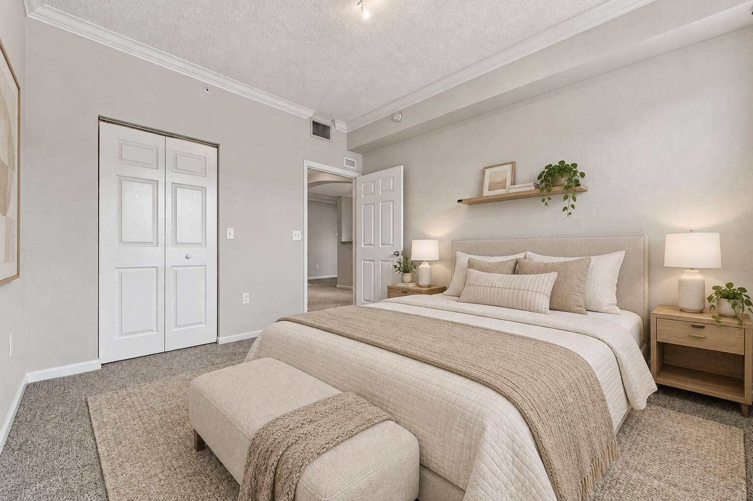 533 NE 3RD Avenue, #202, Fort Lauderdale, FL 33301 Bedroom featuring neutral wall paint, crown molding, wall-to-wall carpeting, and a built-in wall shelf