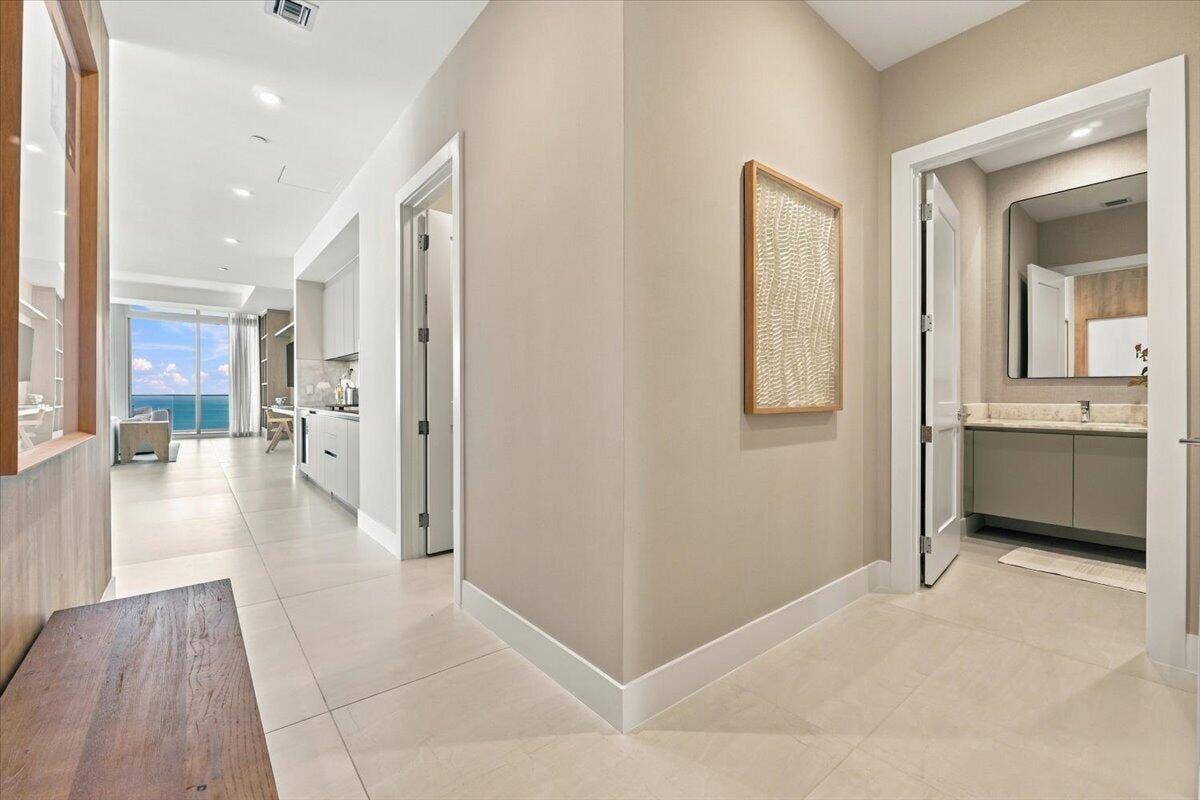 Hallway to living area and owner's suite