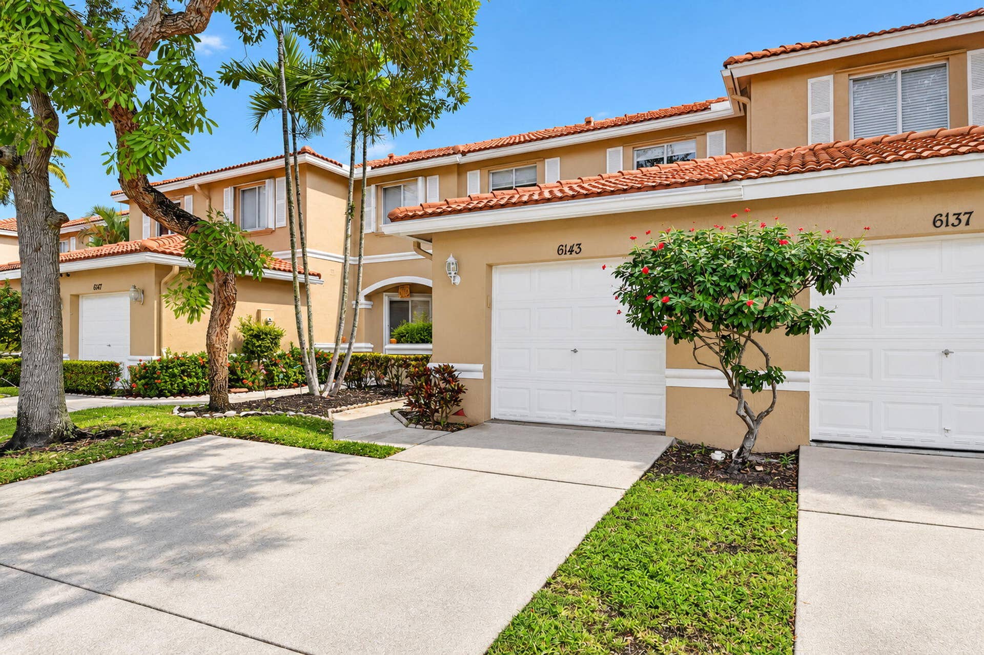 6143 Whalton Street, West Palm Beach, FL 33411 Gutters on front and rear. Garage keypad for easy access.