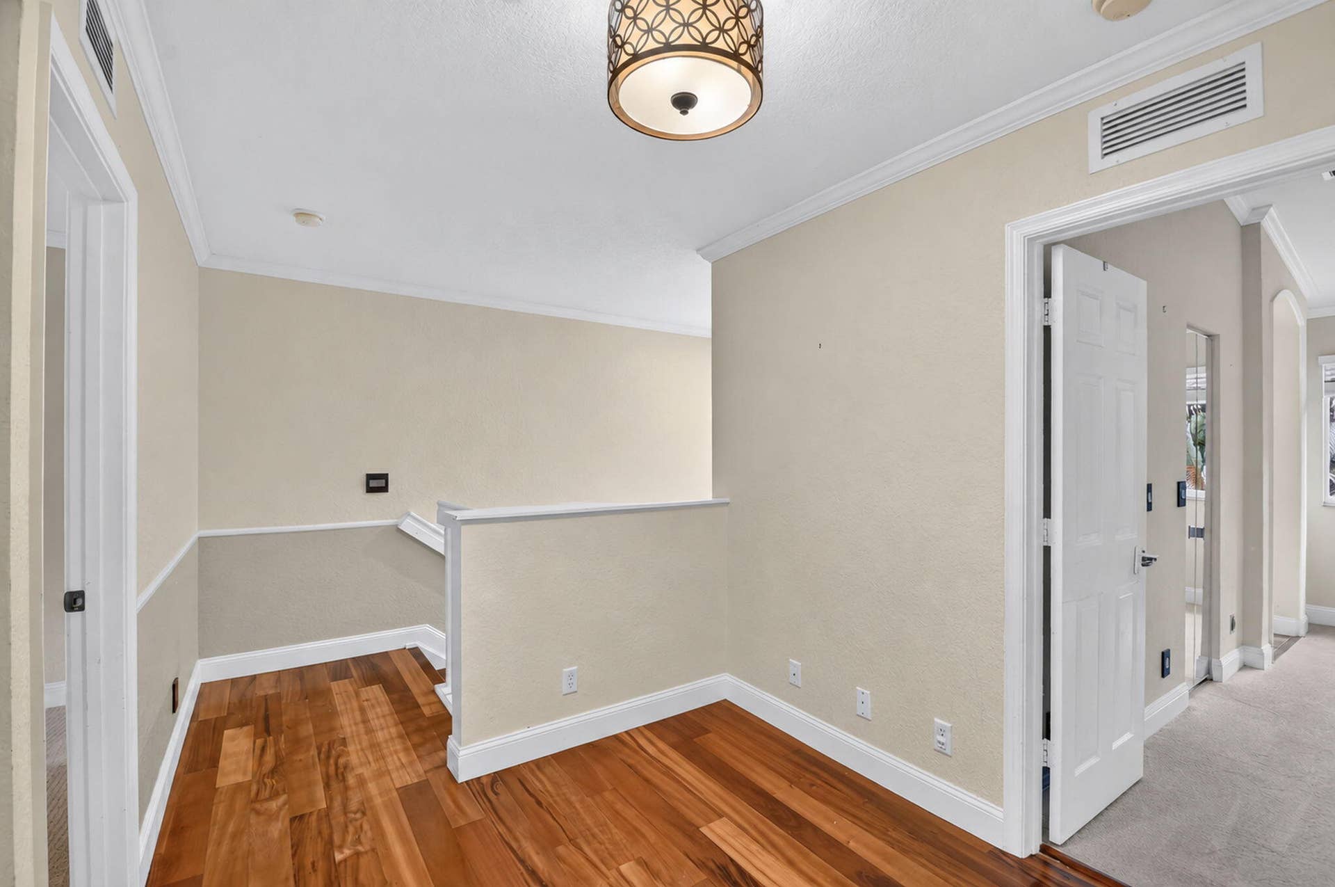 6143 Whalton Street, West Palm Beach, FL 33411 Wood floors on landing and stairs.