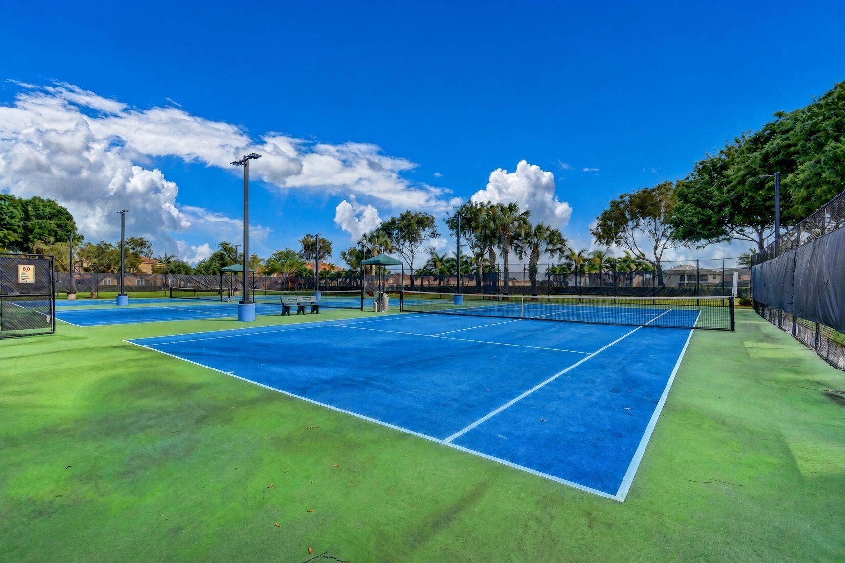 6143 Whalton Street, West Palm Beach, FL 33411 Three tennis courts and pickle ball court