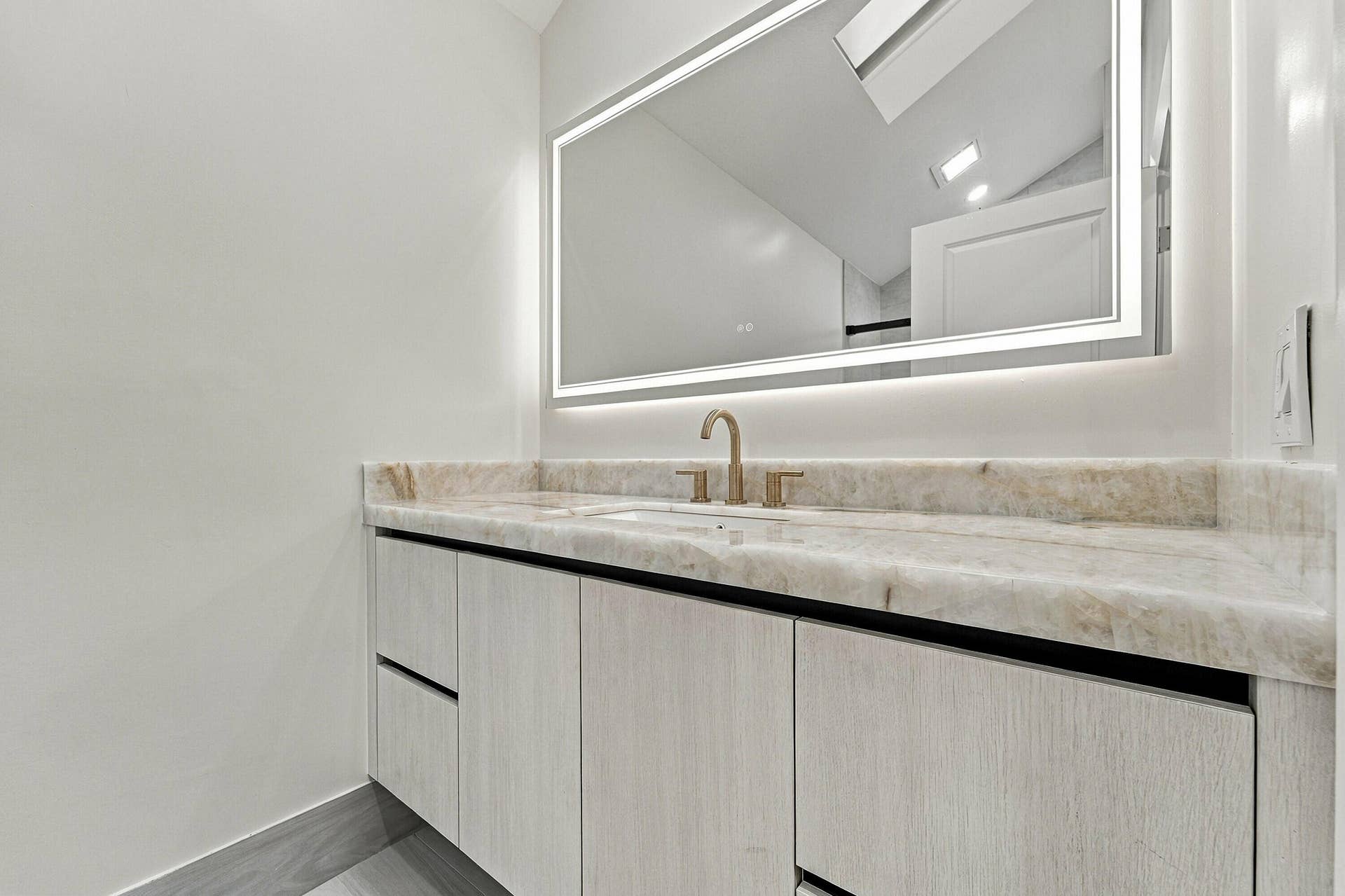 2398 Saratoga Bay Drive, West Palm Beach, FL 33409 guest bathroom - beautiful gold accents