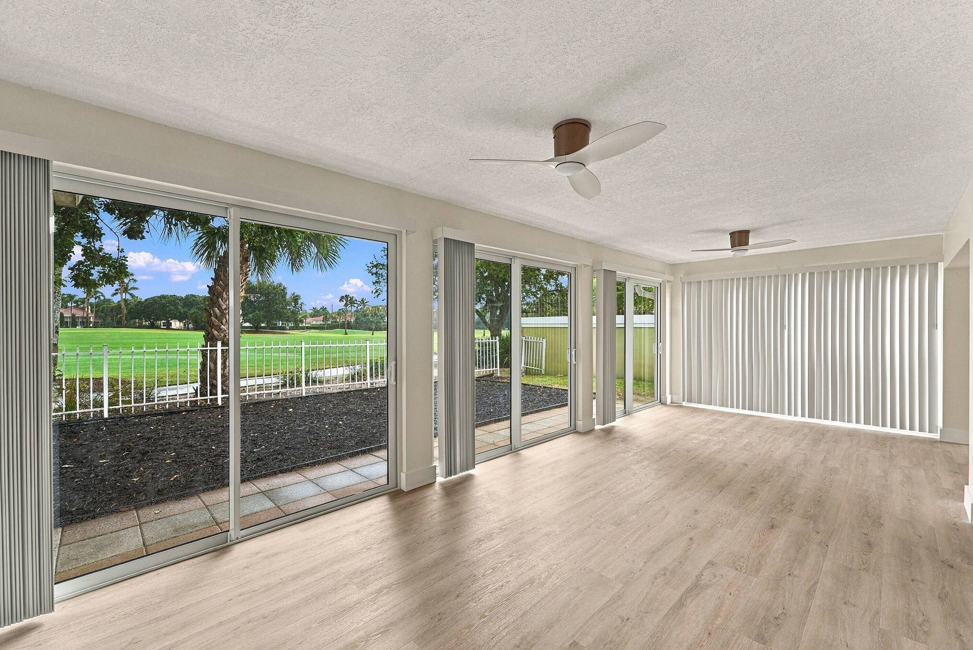 2398 Saratoga Bay Drive, West Palm Beach, FL 33409 The patio was enclosed to add additional living space along with brand new impact windows.