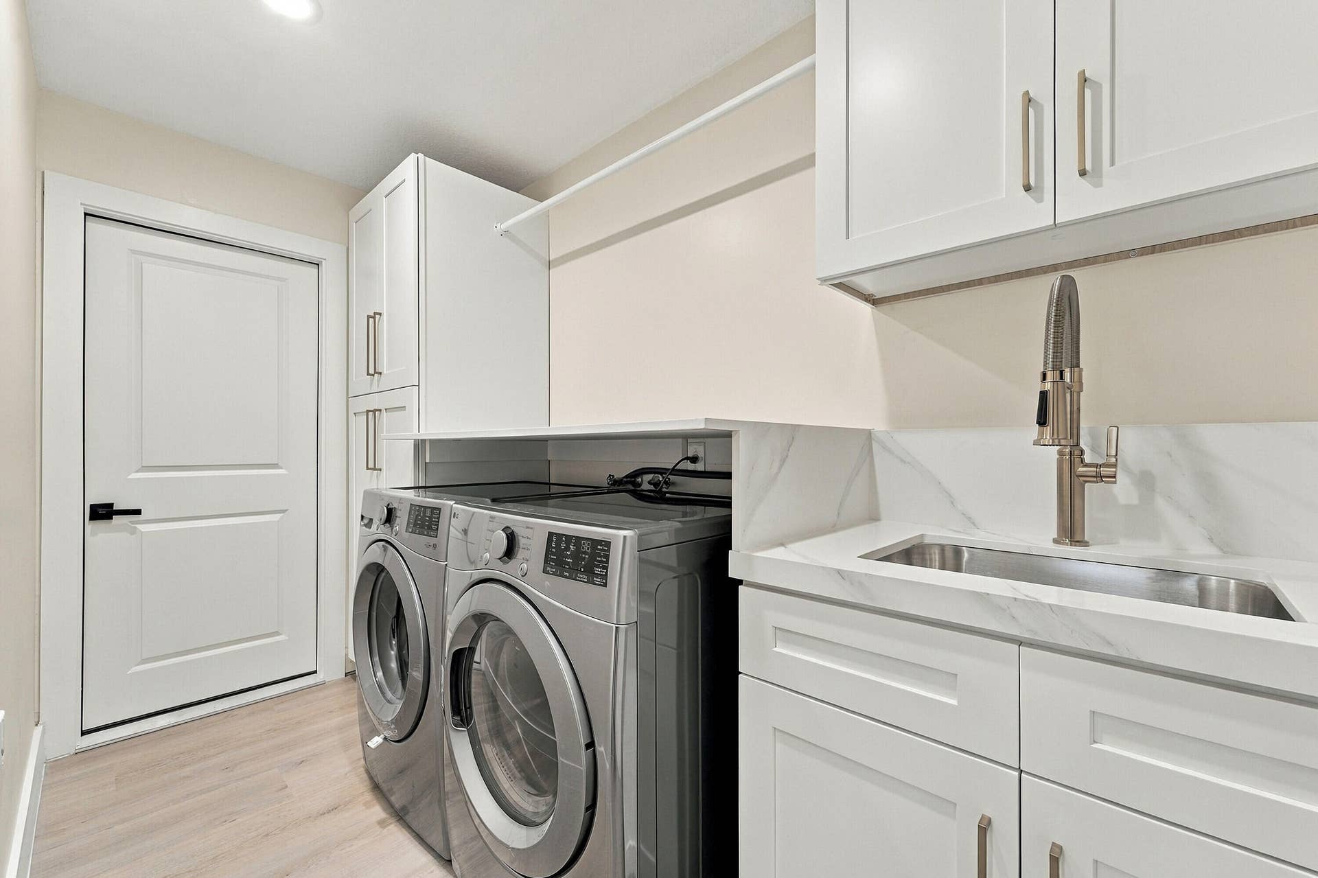 2398 Saratoga Bay Drive, West Palm Beach, FL 33409 Brand new GE washer and dryer and custom cabinets to make this laundry room ideal