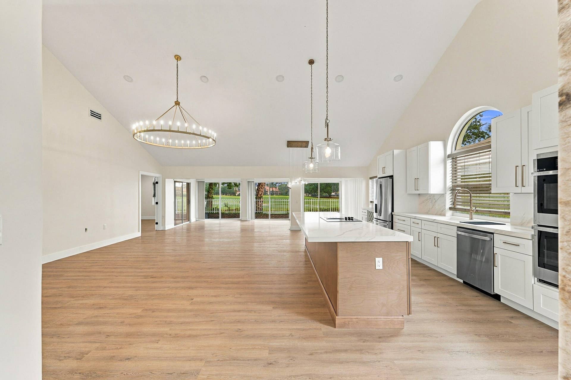2398 Saratoga Bay Drive, West Palm Beach, FL 33409 Brand new laminate floors throughout this open floor plan