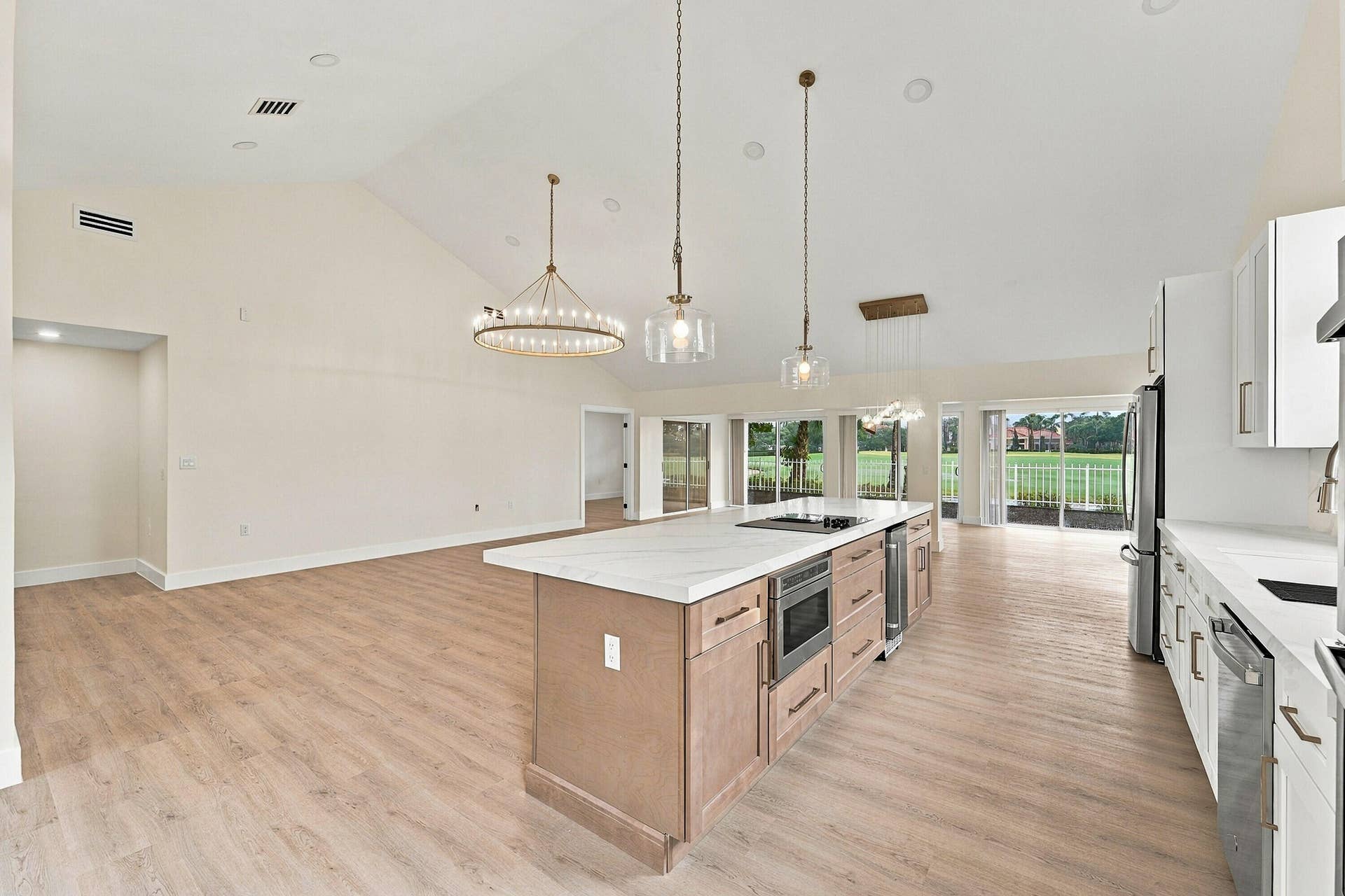 2398 Saratoga Bay Drive, West Palm Beach, FL 33409 Custom chef's kitchen with brand new GE appliances and beautiful gold accents throughout
