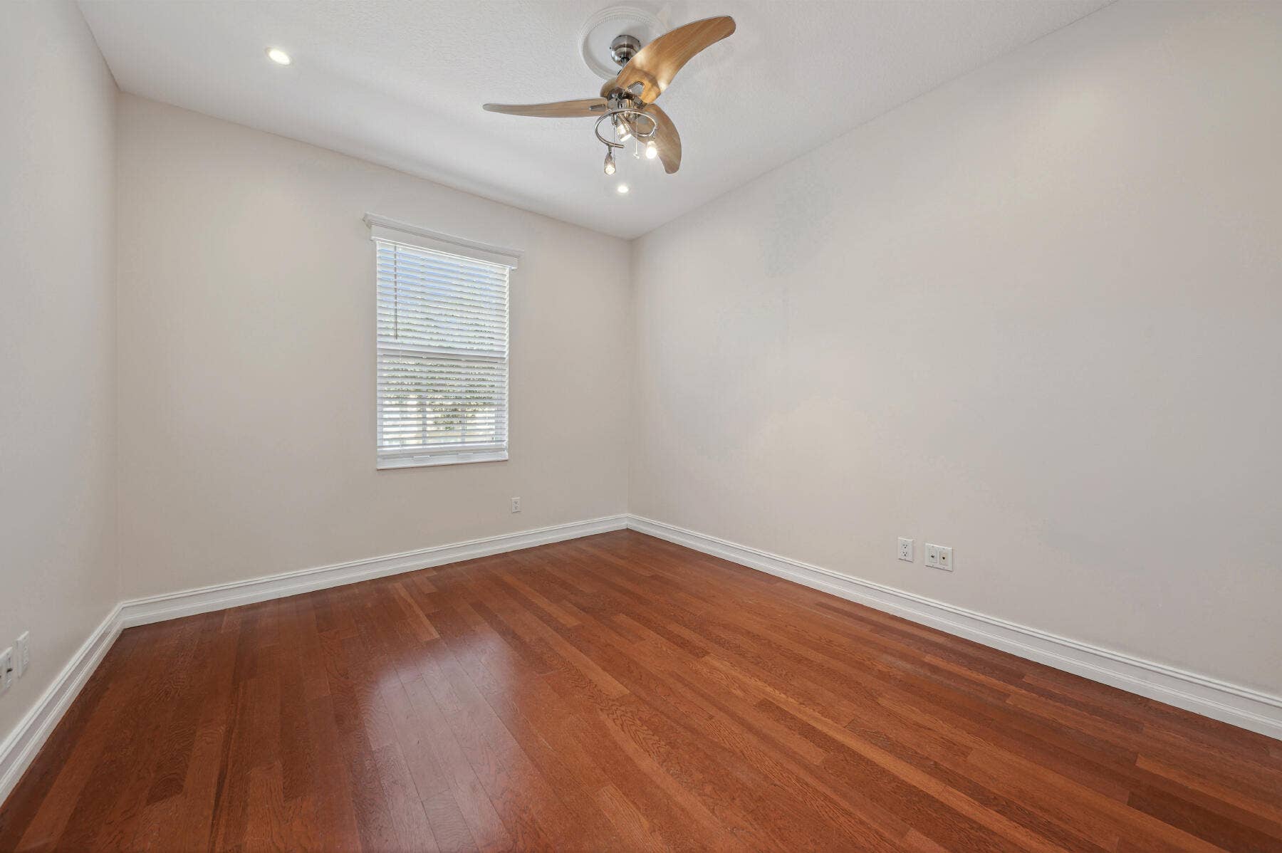 477 Capistrano Drive, Palm Beach Gardens, Palm Beach Gardens, FL 33410 Room featuring wood-finish flooring, recessed lighting, and a three-blade ceiling fan with integrated lighting