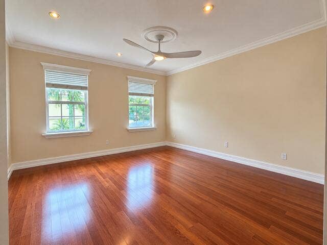 477 Capistrano Drive, Palm Beach Gardens, Palm Beach Gardens, FL 33410 Room featuring wood-finish flooring, recessed lighting, crown molding, double windows with window treatments, and a central ceiling fan with a medallion