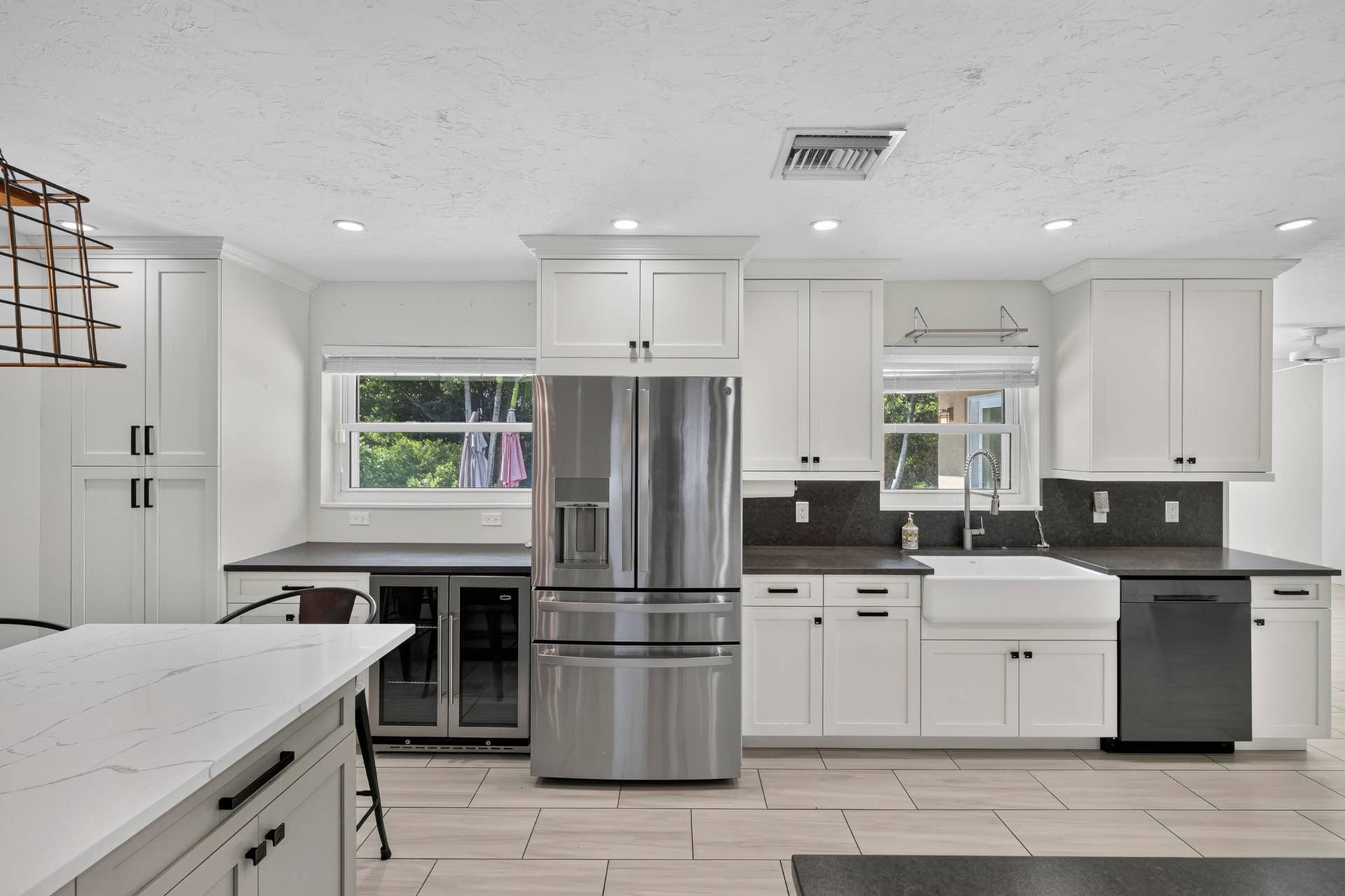 Kitchen With Wine Cooler and Fridge