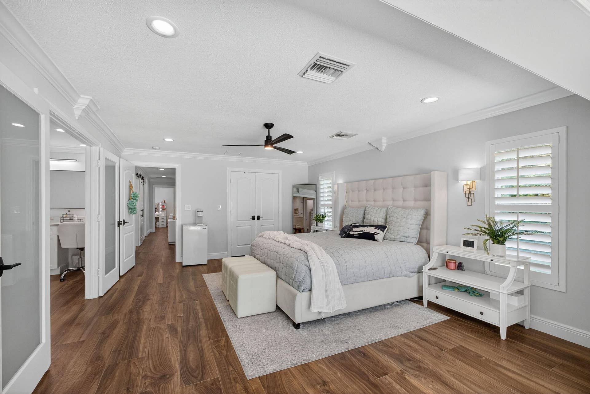 4628 Square Lake Drive, Palm Beach Gardens, FL 33418 Spacious room featuring wood-finish flooring, recessed lighting, crown molding, plantation shutters, and a ceiling fan