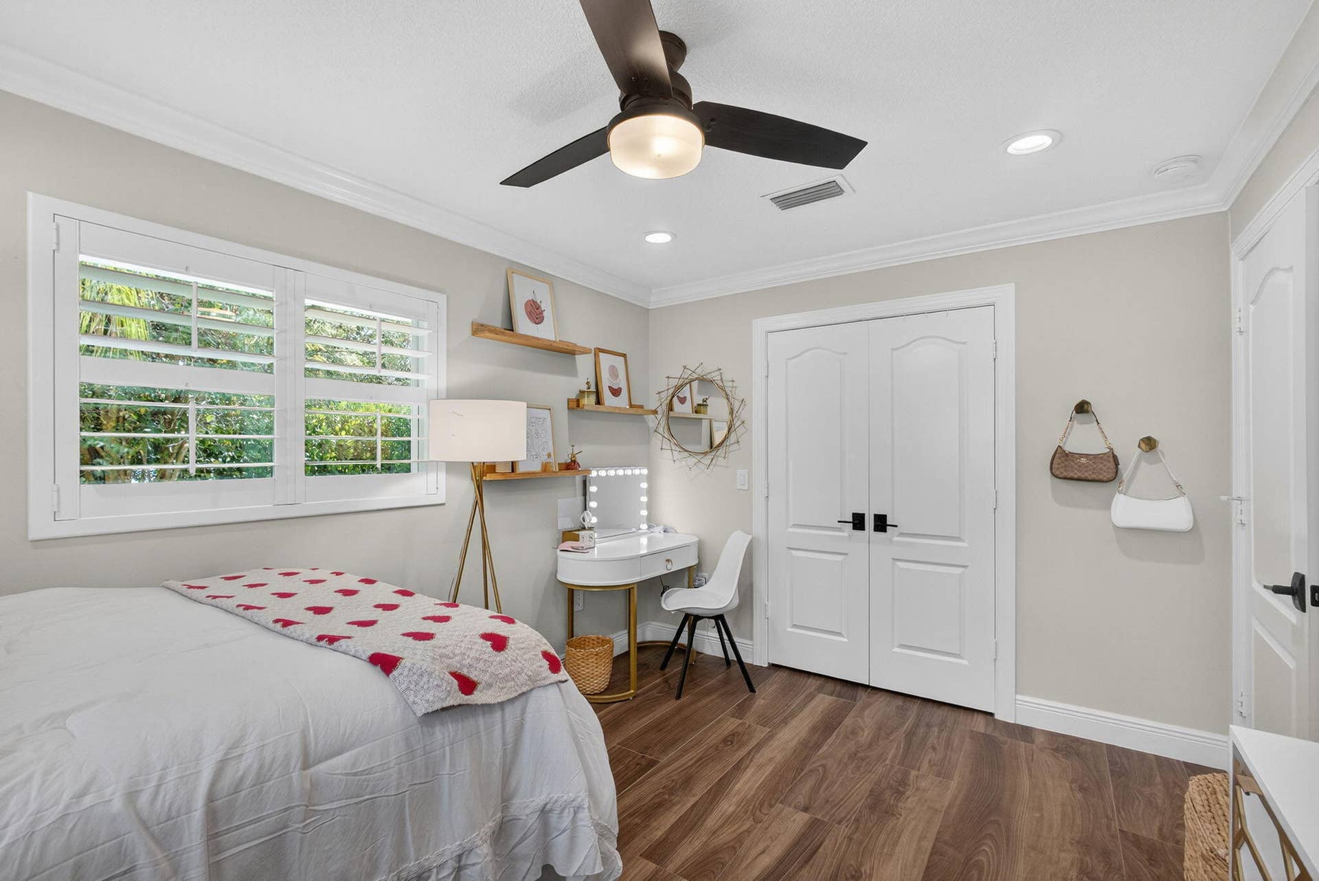 4628 Square Lake Drive, Palm Beach Gardens, FL 33418 Room featuring wood-finish flooring, plantation shutters, a ceiling fan with integrated lighting, recessed lighting, and double doors with matte black hardware