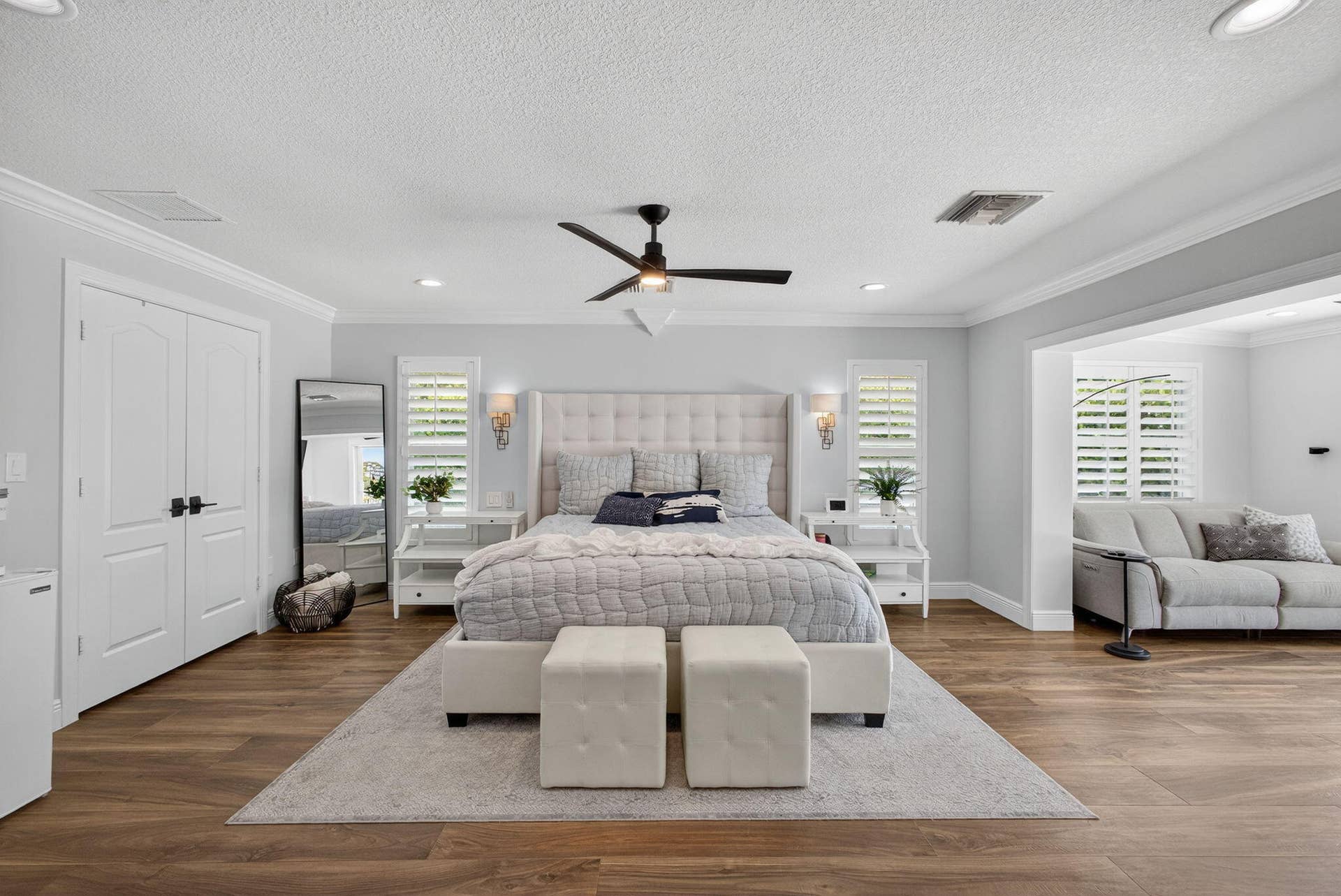 4628 Square Lake Drive, Palm Beach Gardens, FL 33418 Wood-finish flooring, recessed lighting, crown molding, double doors, and interior plantation shutters