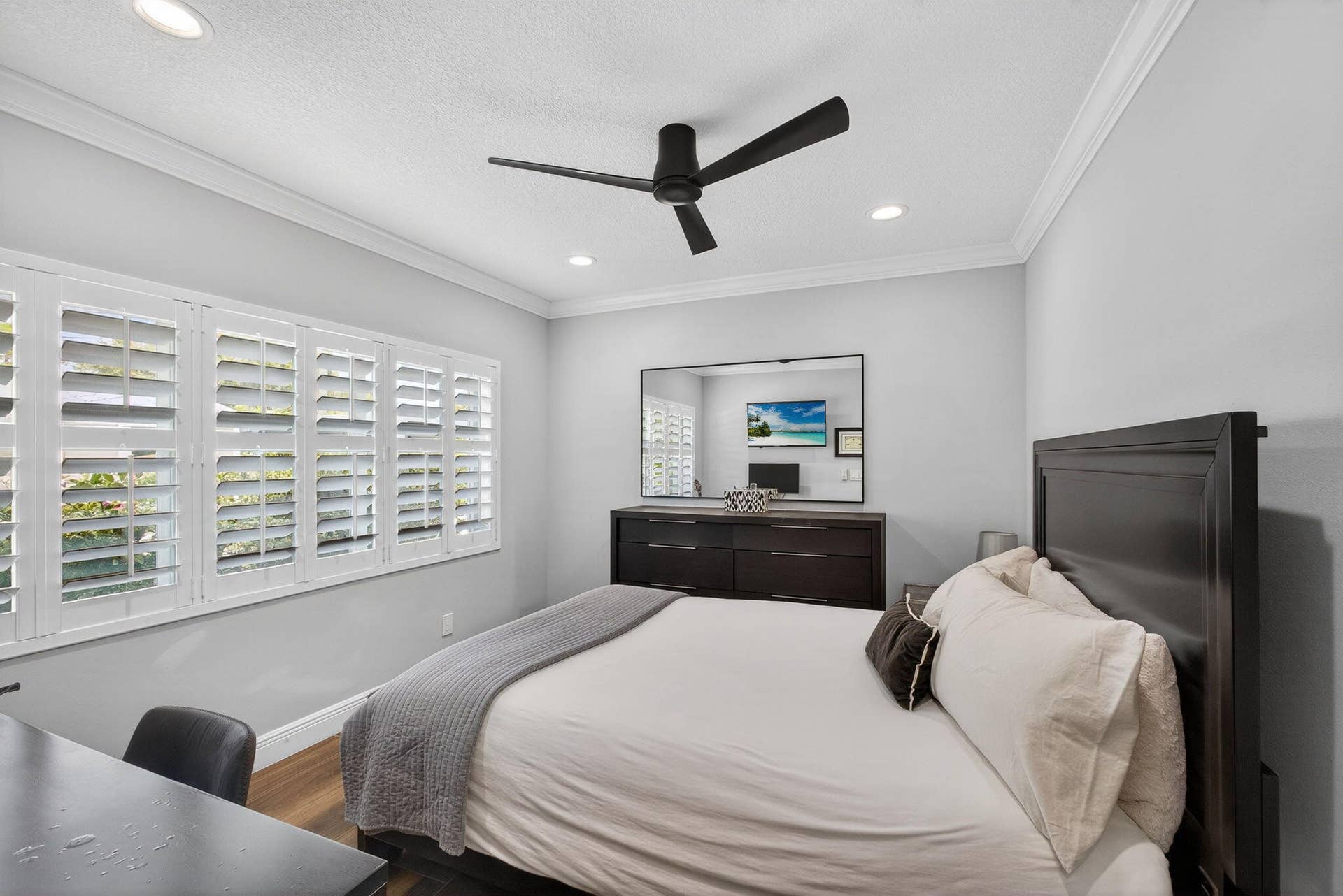 4628 Square Lake Drive, Palm Beach Gardens, FL 33418 Room featuring wood-finish flooring, crown molding, plantation shutters, a contemporary ceiling fan, and recessed lighting