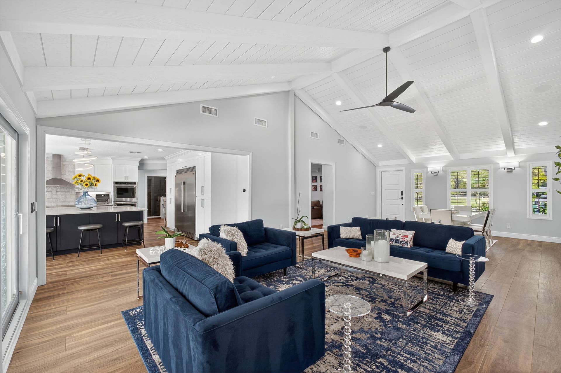 4628 Square Lake Drive, Palm Beach Gardens, FL 33418 Vaulted ceilings with exposed beams, wood-finish flooring, recessed lighting, and a modern ceiling fan