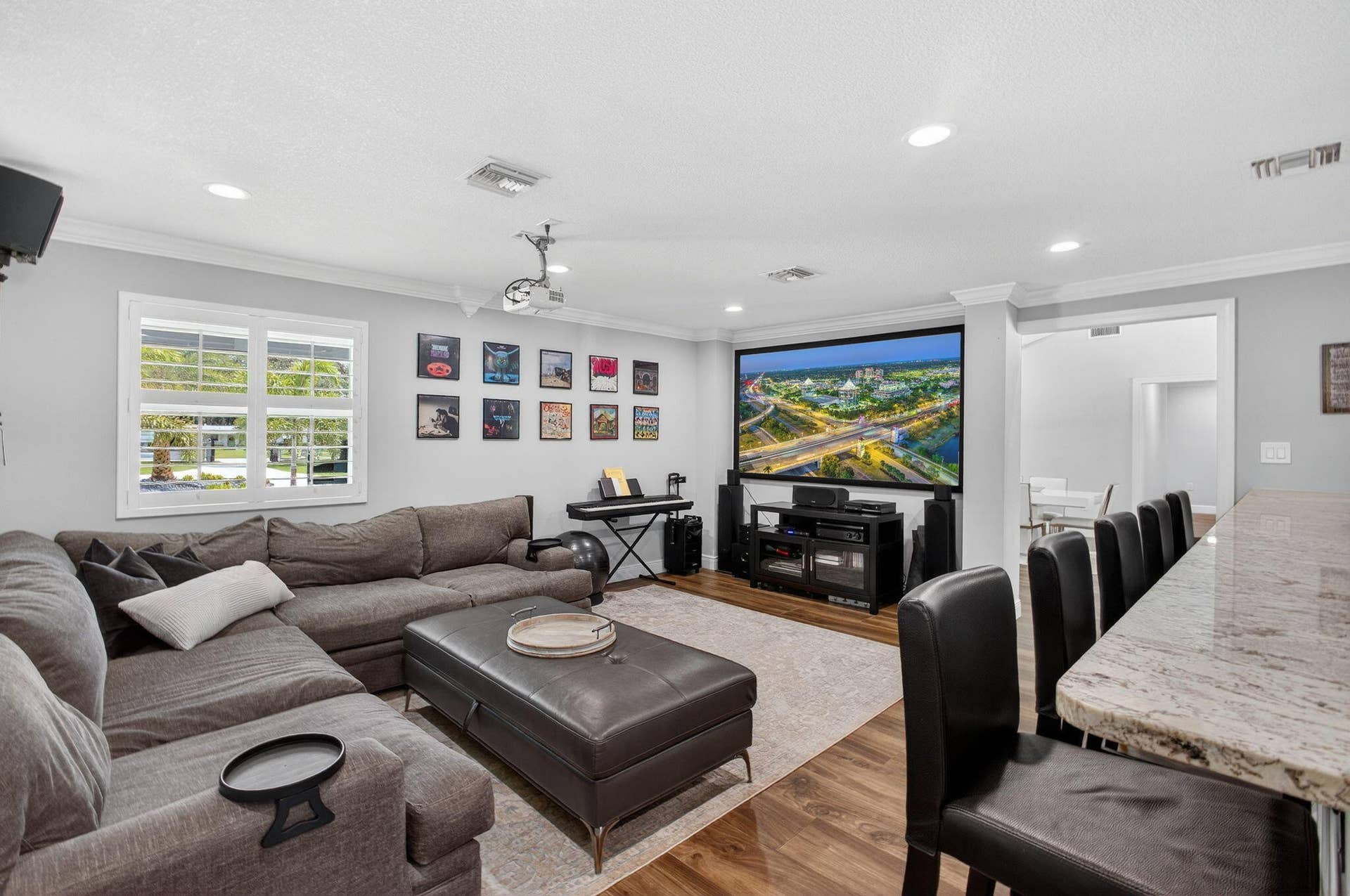 4628 Square Lake Drive, Palm Beach Gardens, FL 33418 Wood-finish flooring, recessed lighting, crown molding, and plantation shutters