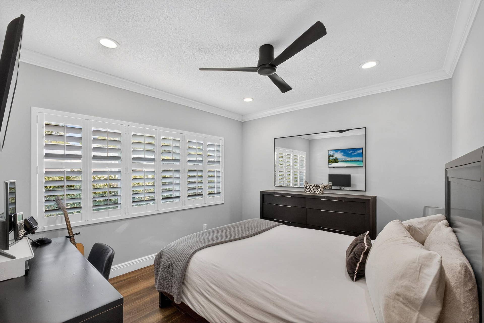 4628 Square Lake Drive, Palm Beach Gardens, FL 33418 Wood-finish flooring, plantation shutters, crown molding, recessed lighting, and a modern ceiling fan