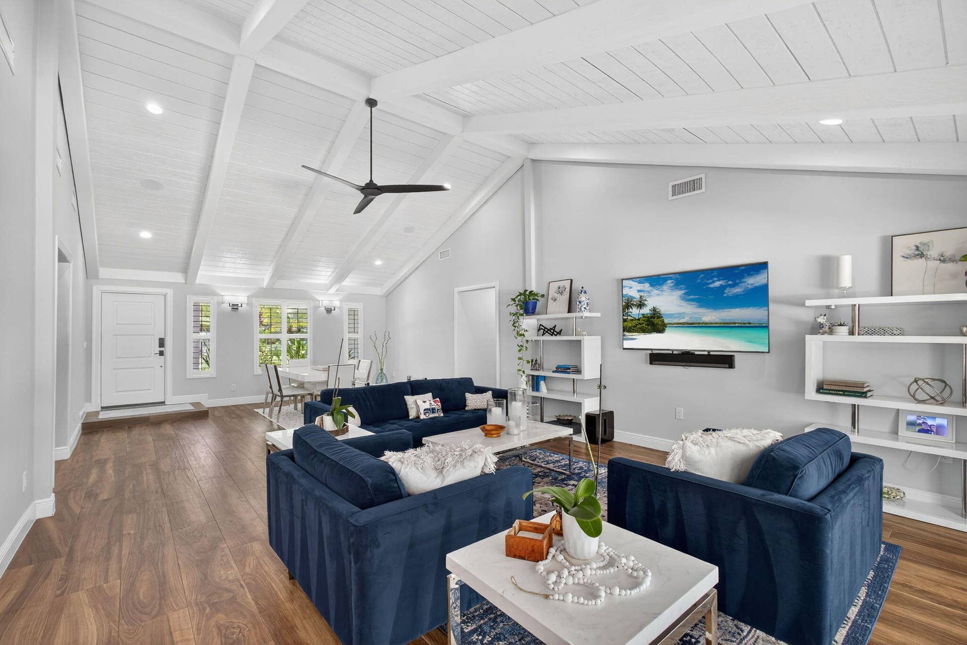 4628 Square Lake Drive, Palm Beach Gardens, FL 33418 Vaulted ceiling with exposed beams, wood-finish flooring, recessed lighting, and built-in white shelving