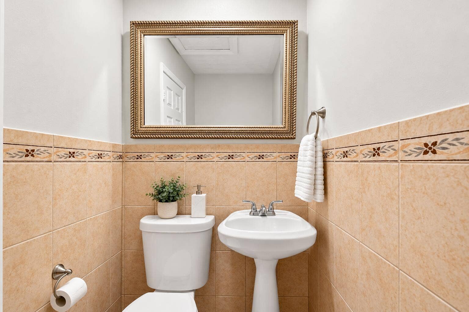 Elegant Beige-Tiled Powder Room