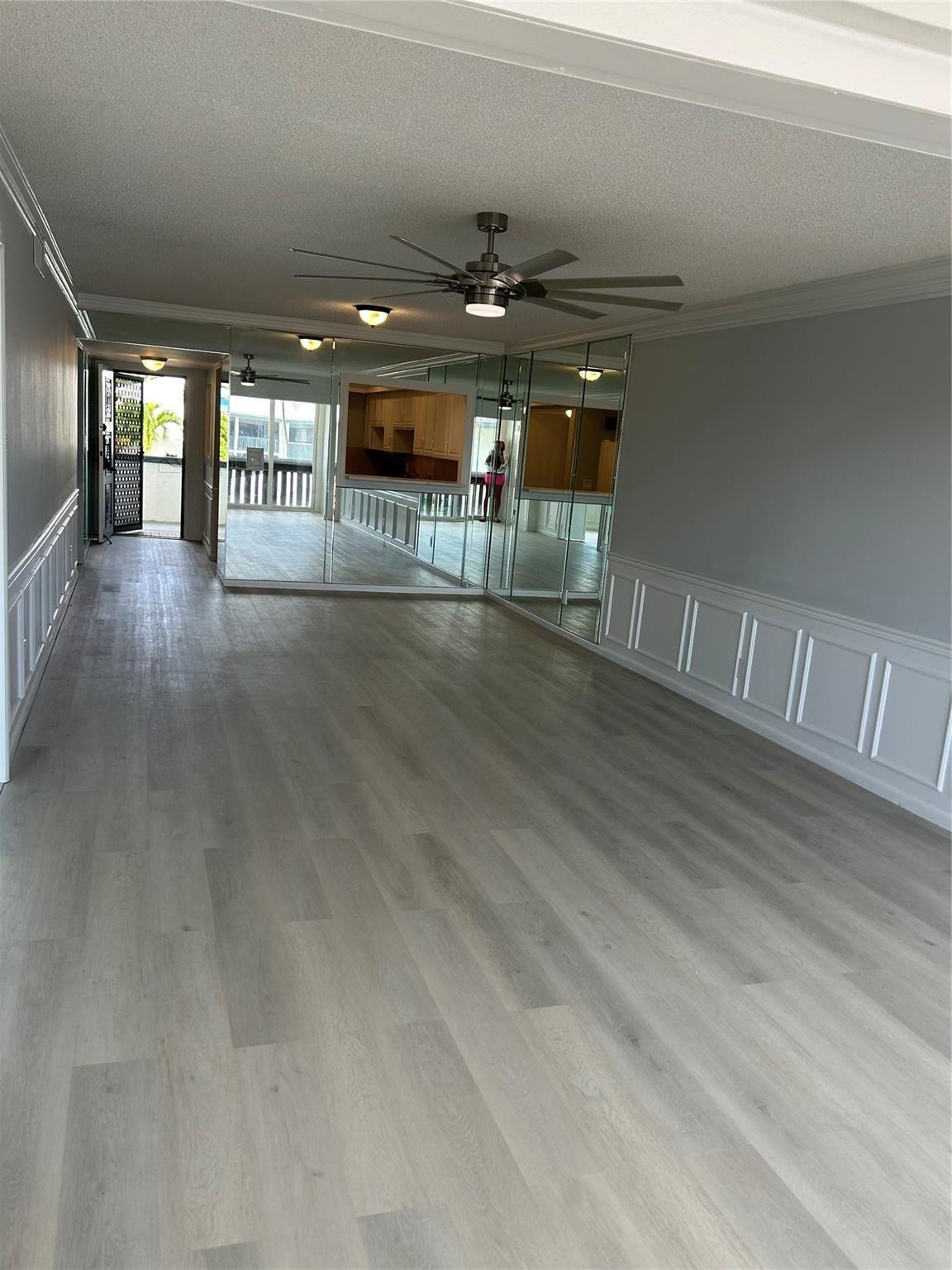 Living / Family space looking towards foyer and kitchen / bar area.