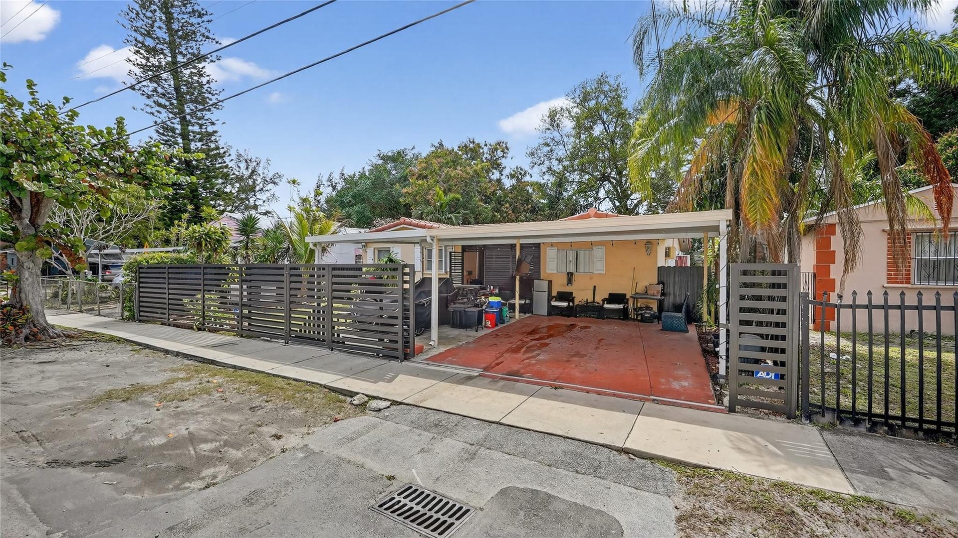 154 NW 67TH Street, Miami, FL 33150 Showcasing gate and carport