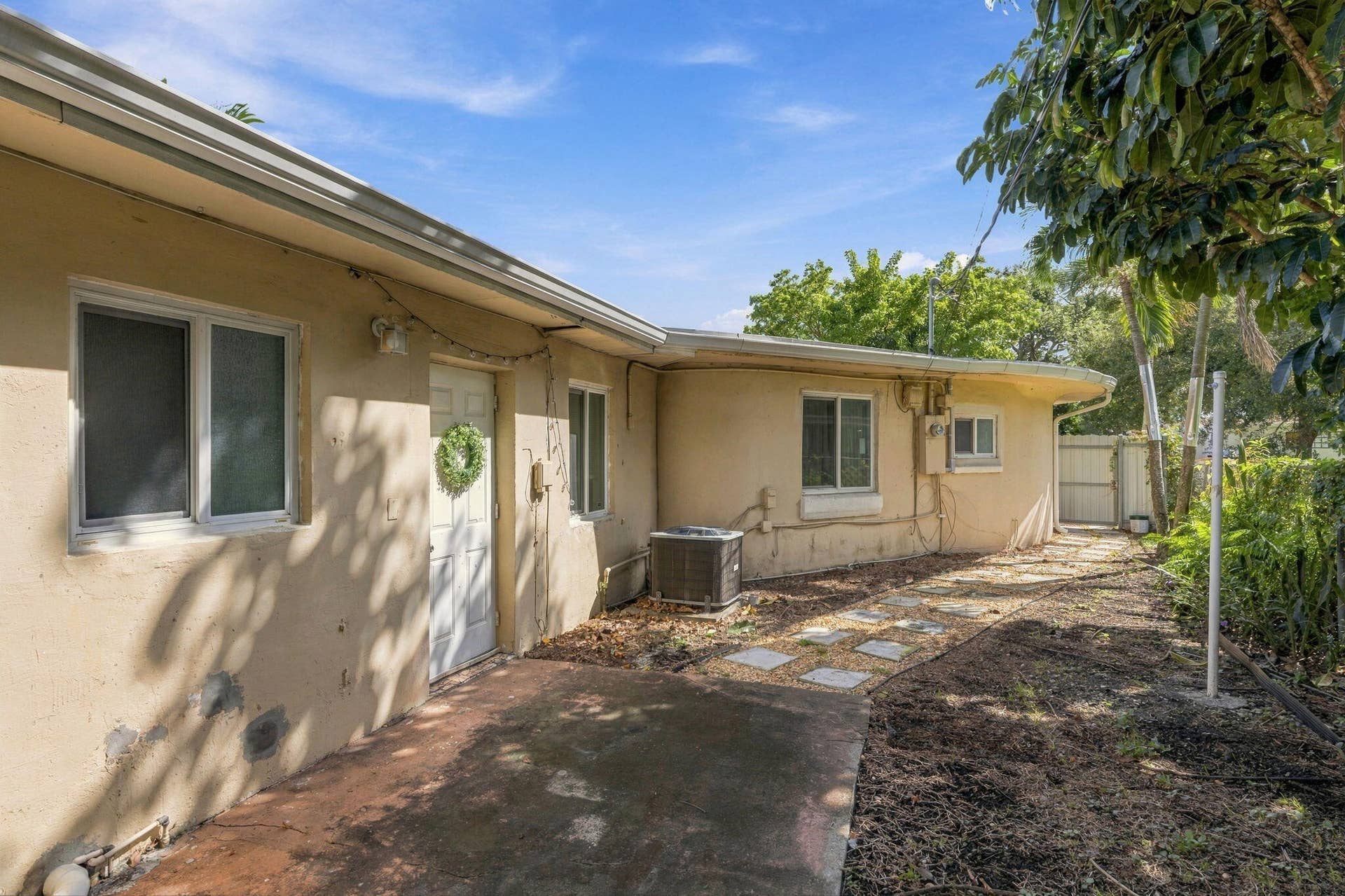 Backyard/Entrance to other side of house