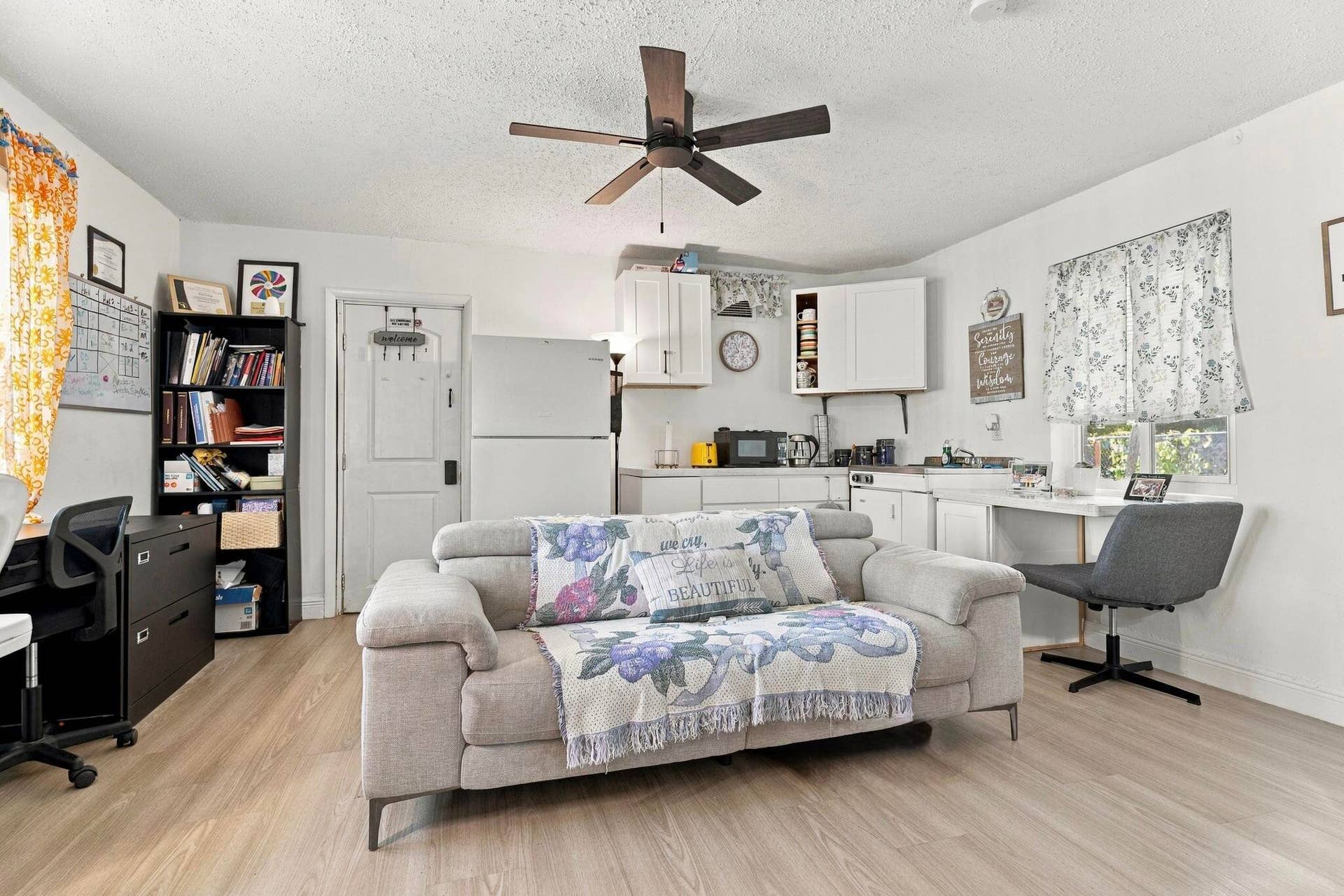 Another living room with a kitchen