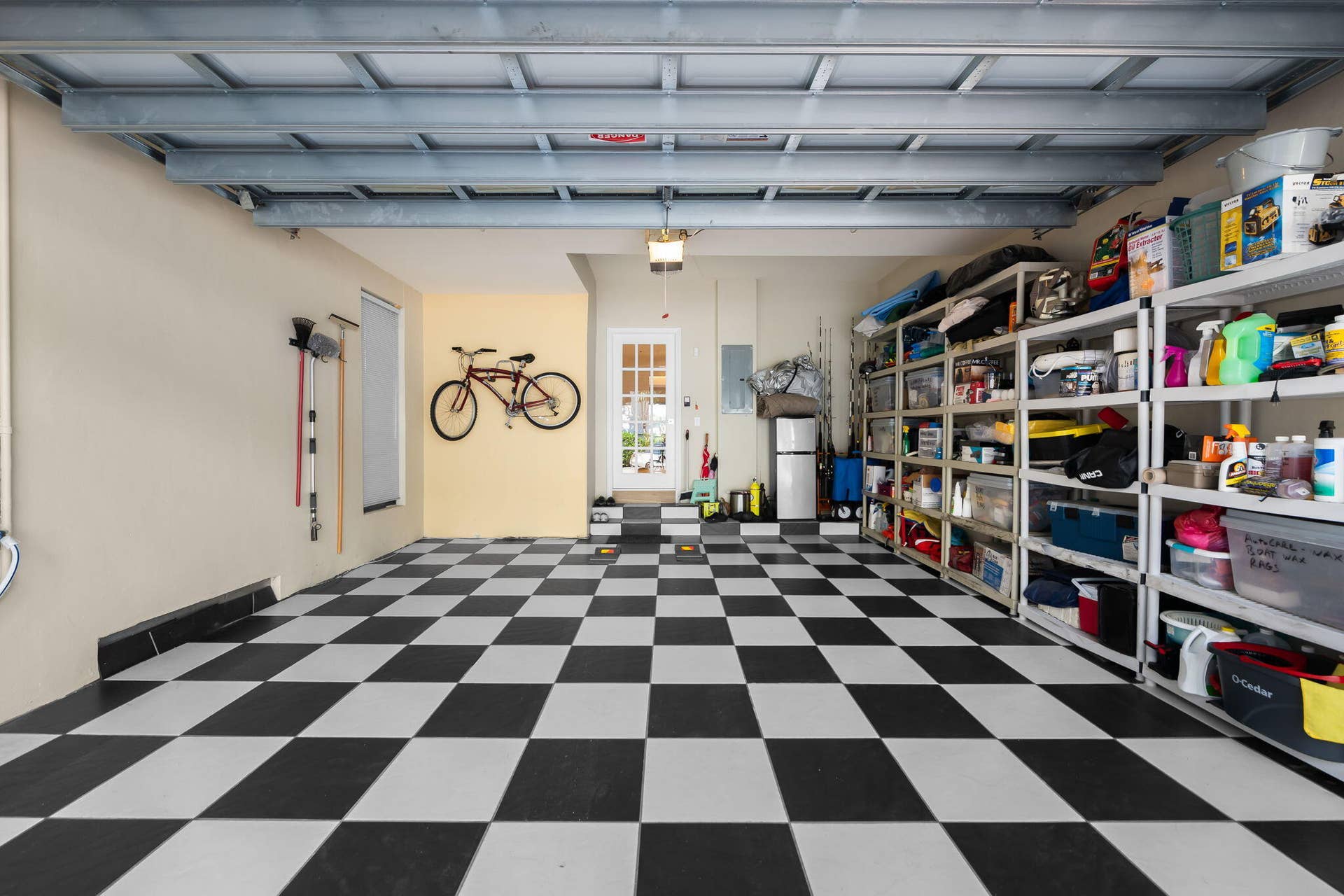 Garage interior featuring a black-and-white checkered flooring
