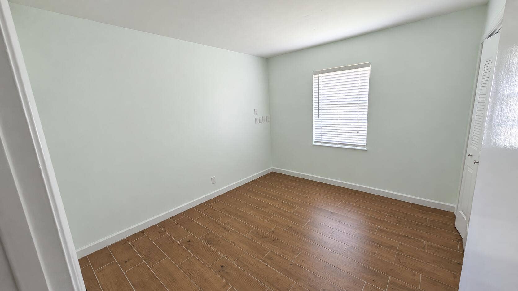 14915 WHATLEY Road, Delray Beach, Delray Beach, FL 33445 Bright Mint Empty Room with Wood-Style F