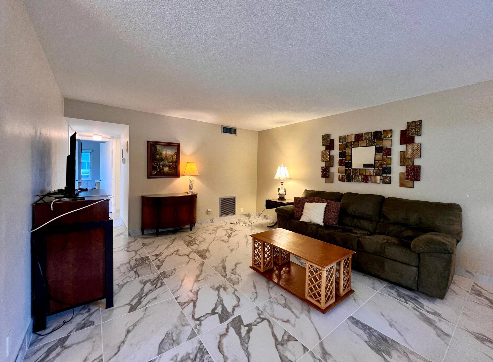 Elegant Living Area With Gorgeous Large Format Tile Flooring!
