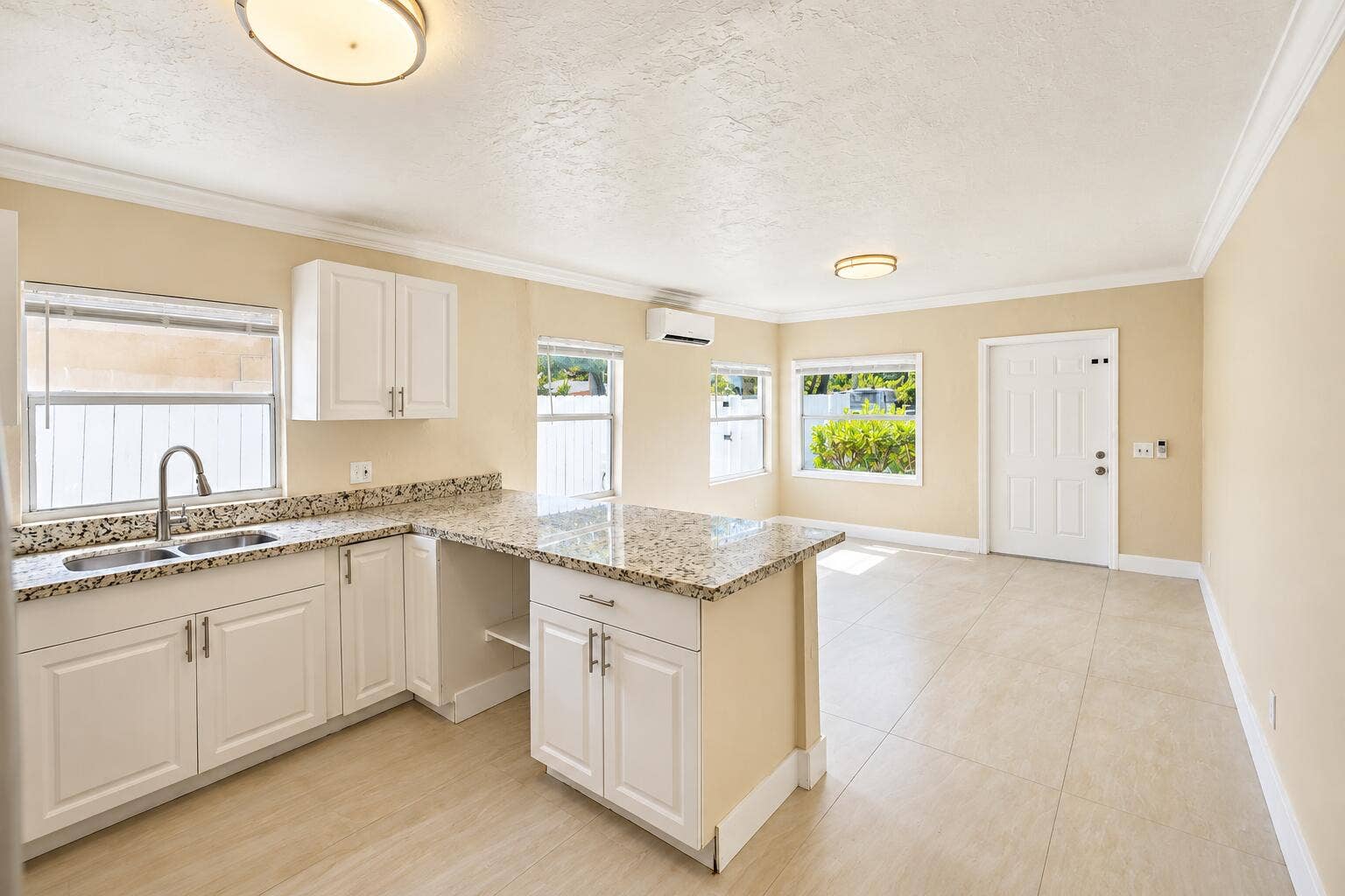 Bright Beige Open-Plan Kitchen and Livin