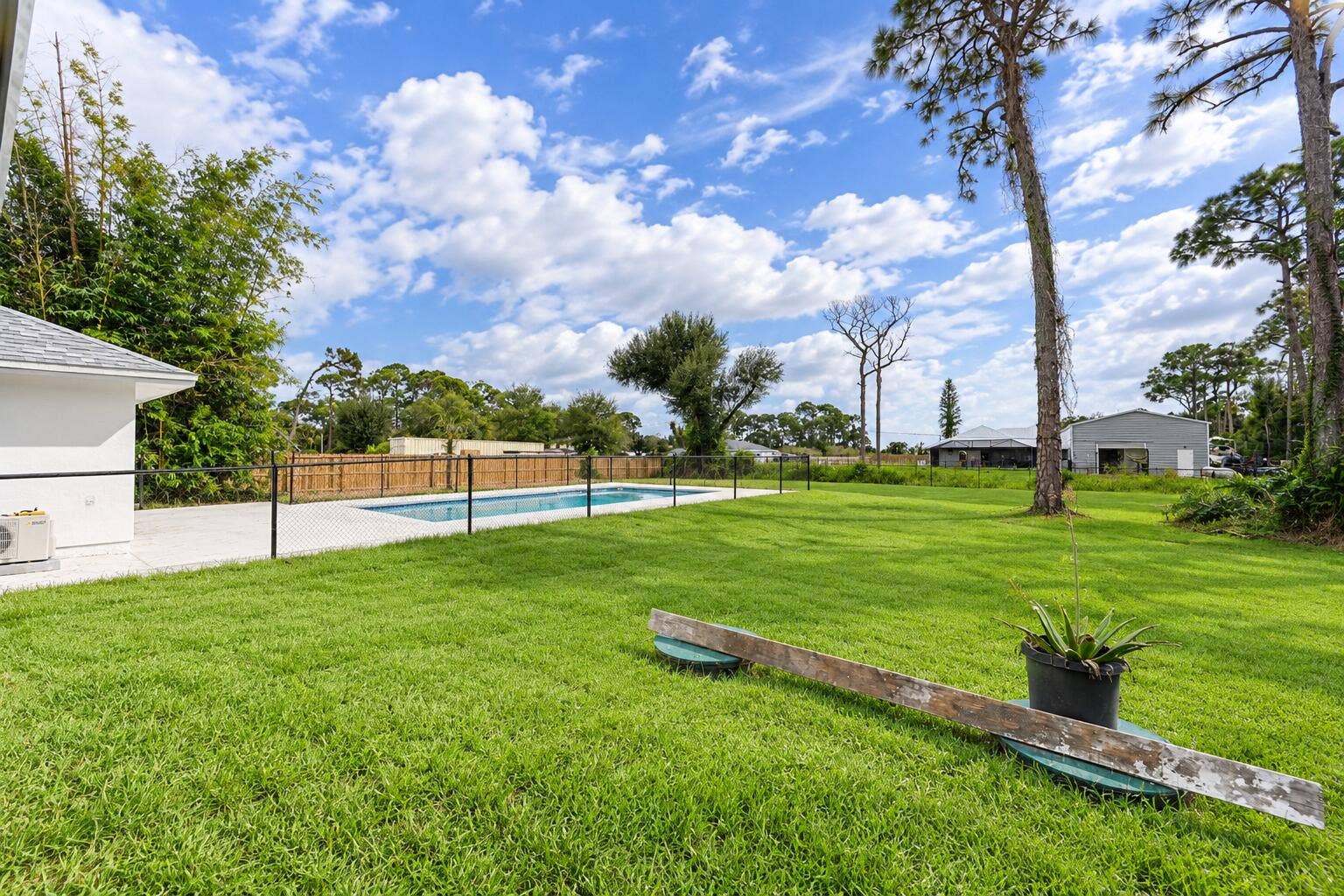 8721 HIDDEN PINES Road, Fort Pierce, FL 34945 Rear