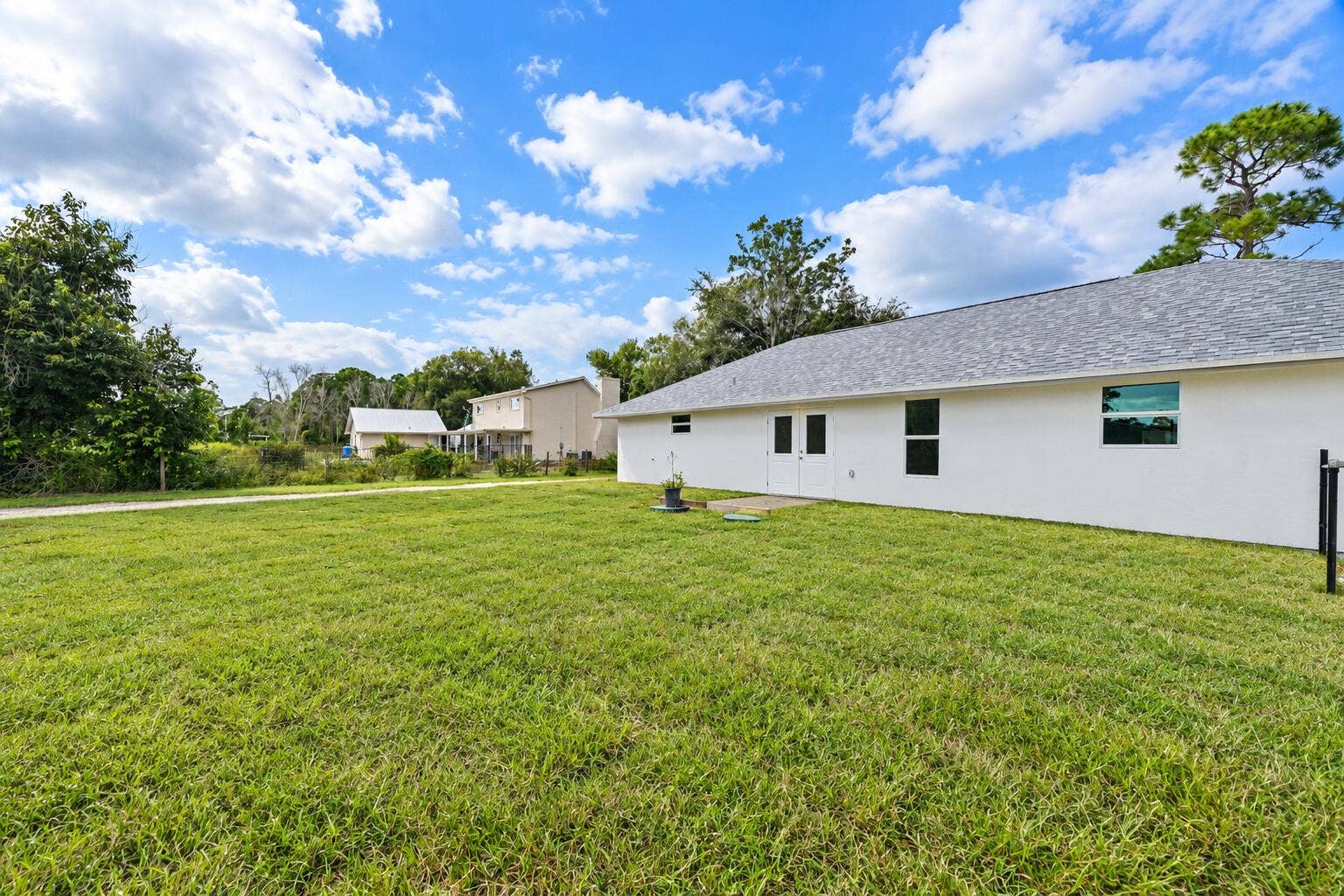 8721 HIDDEN PINES Road, Fort Pierce, FL 34945 Rear