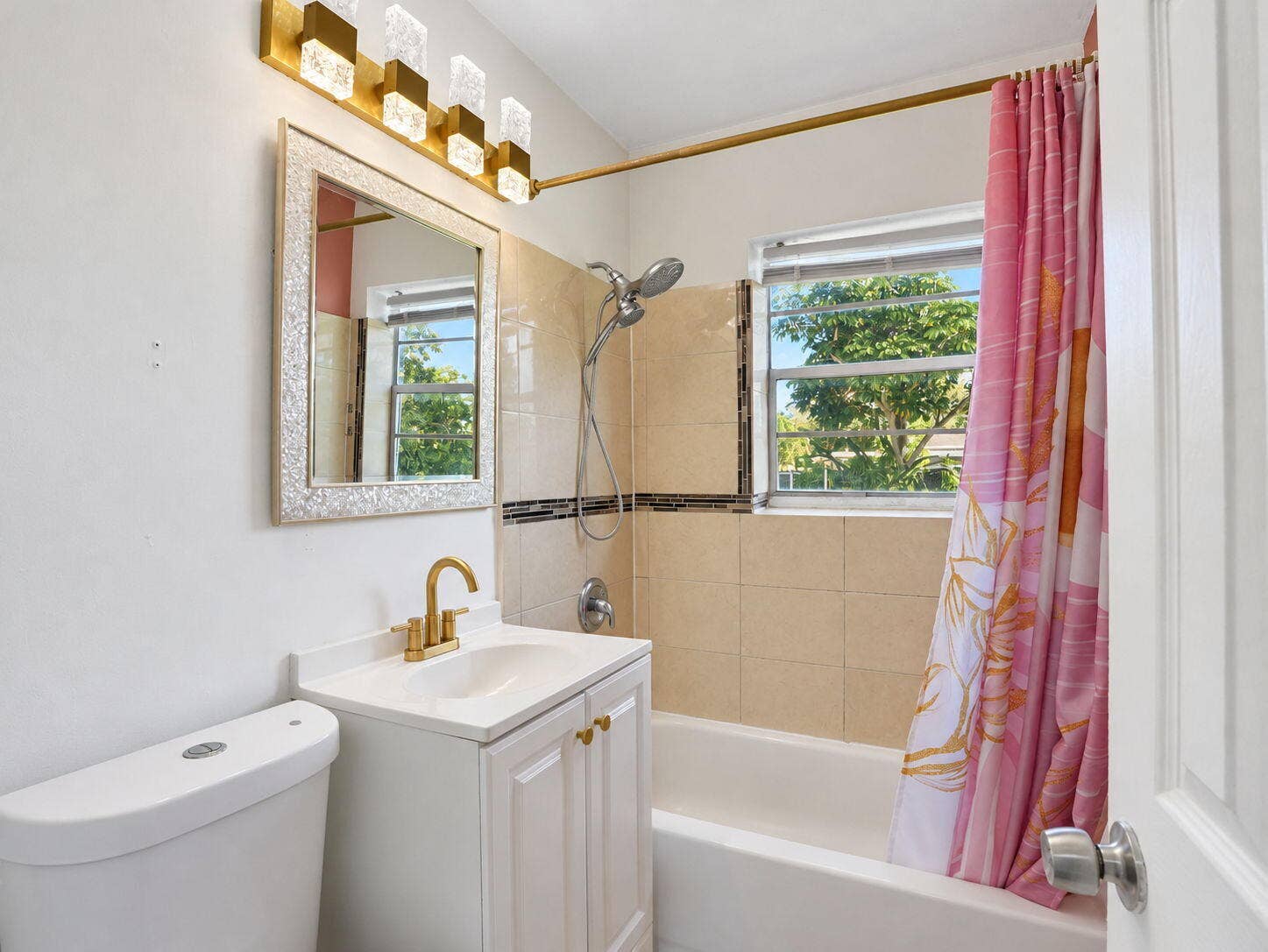 1805 NW 13TH Court, Fort Lauderdale, FL 33311 Bathroom featuring gold accents and handheld shower head