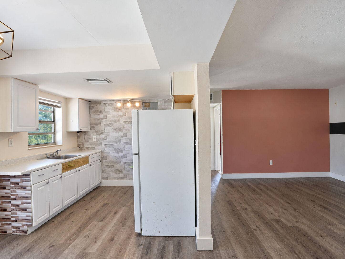 1805 NW 13TH Court, Fort Lauderdale, FL 33311 Kitchen featuring white shaker-style cabinetry, and wood-finish flooring