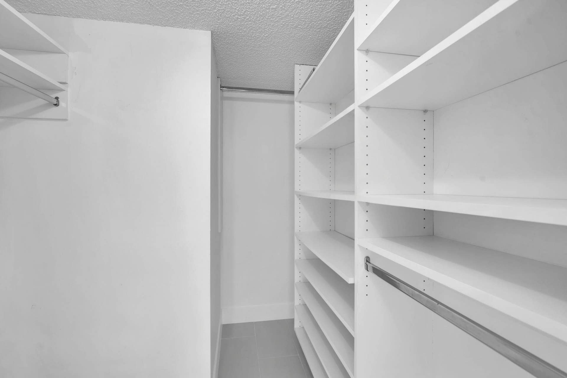 Primary bedroom walk-in closet