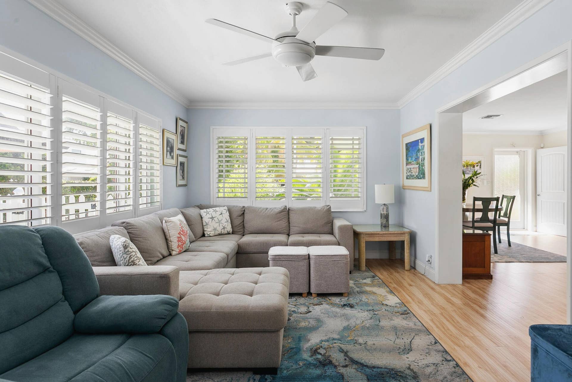 2607 SE 21ST Street, Fort Lauderdale, FL 33316 Spacious Living area featuring plantation shutters, crown molding, and wood-finish flooring