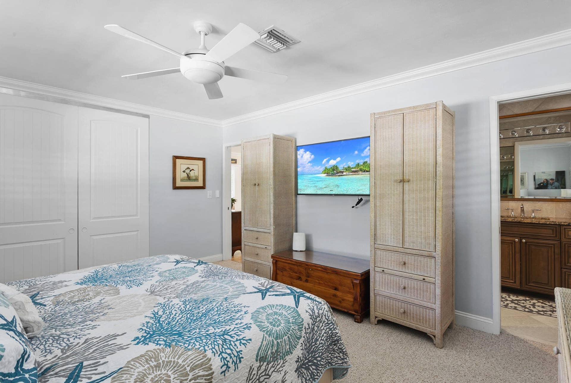 2607 SE 21ST Street, Fort Lauderdale, FL 33316 Neutral interior featuring crown molding, a ceiling fan, and double-door closet cabinetry