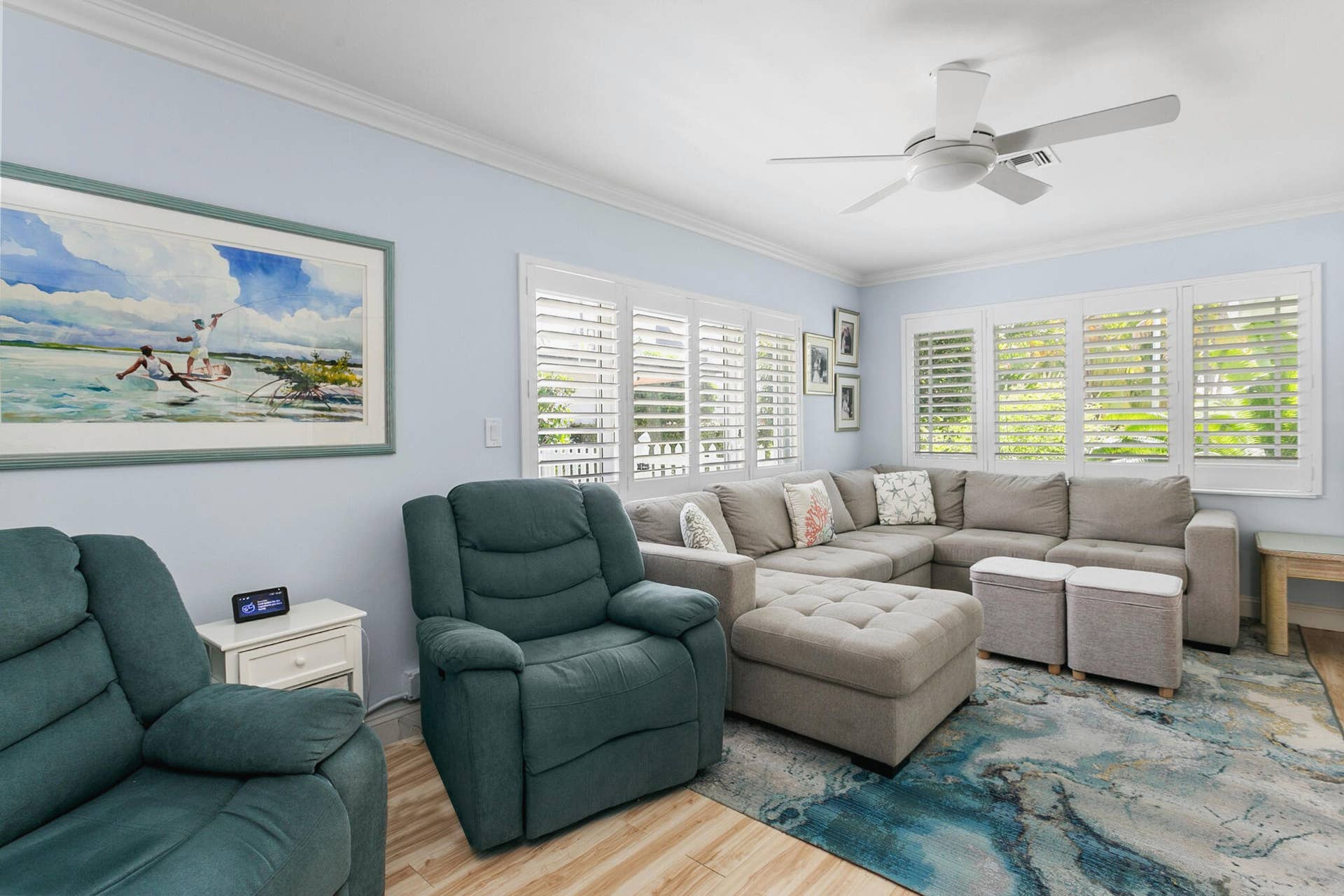 2607 SE 21ST Street, Fort Lauderdale, FL 33316 Bright interior featuring crown molding, multi-panel plantation shutters, and a central ceiling fan