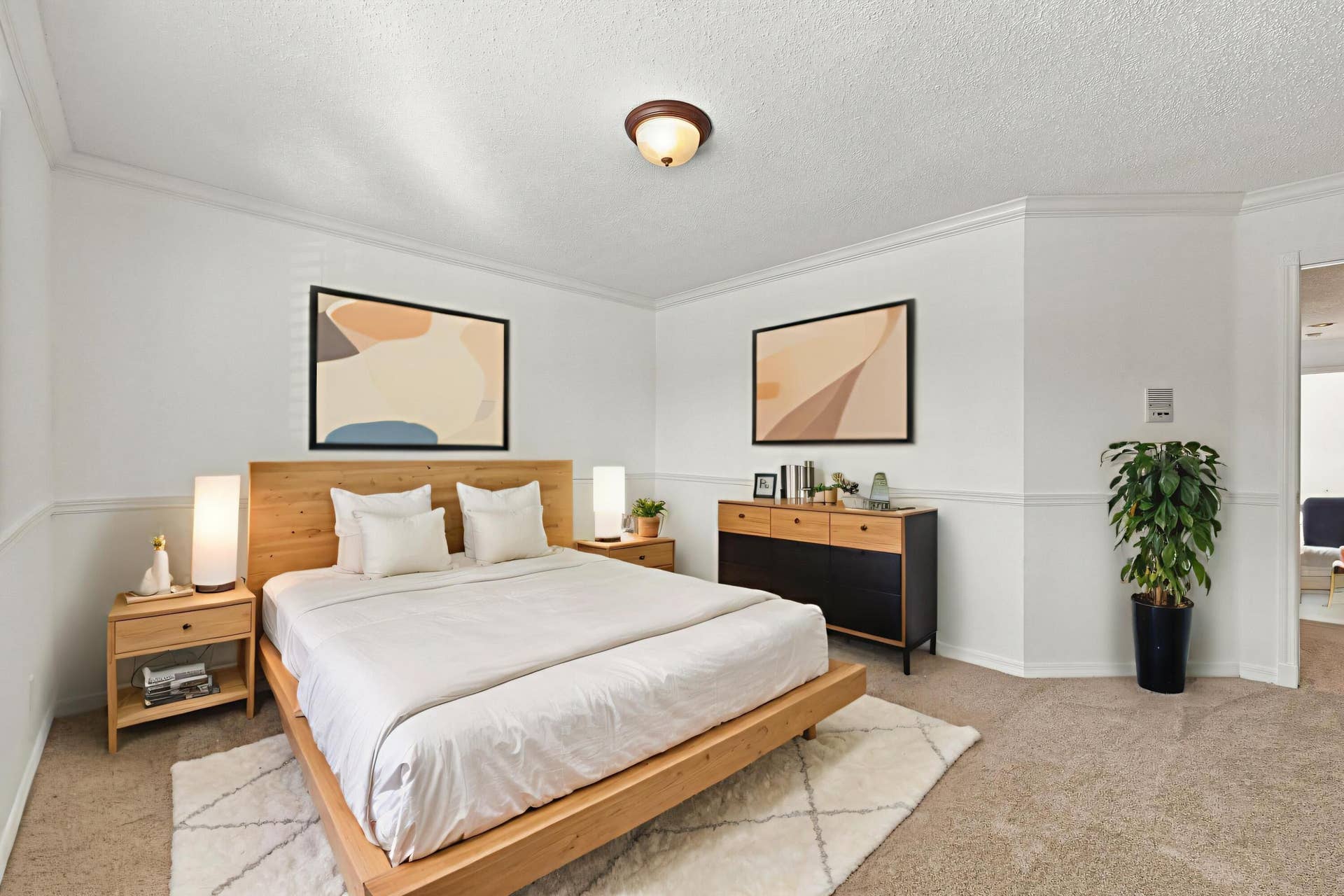 10671 St Thomas Drive, Boca Raton, FL 33498 With its generous proportions, neutral carpeting, and decorative wall details, this bedroom offers flexibility for guests, family, or a home office.