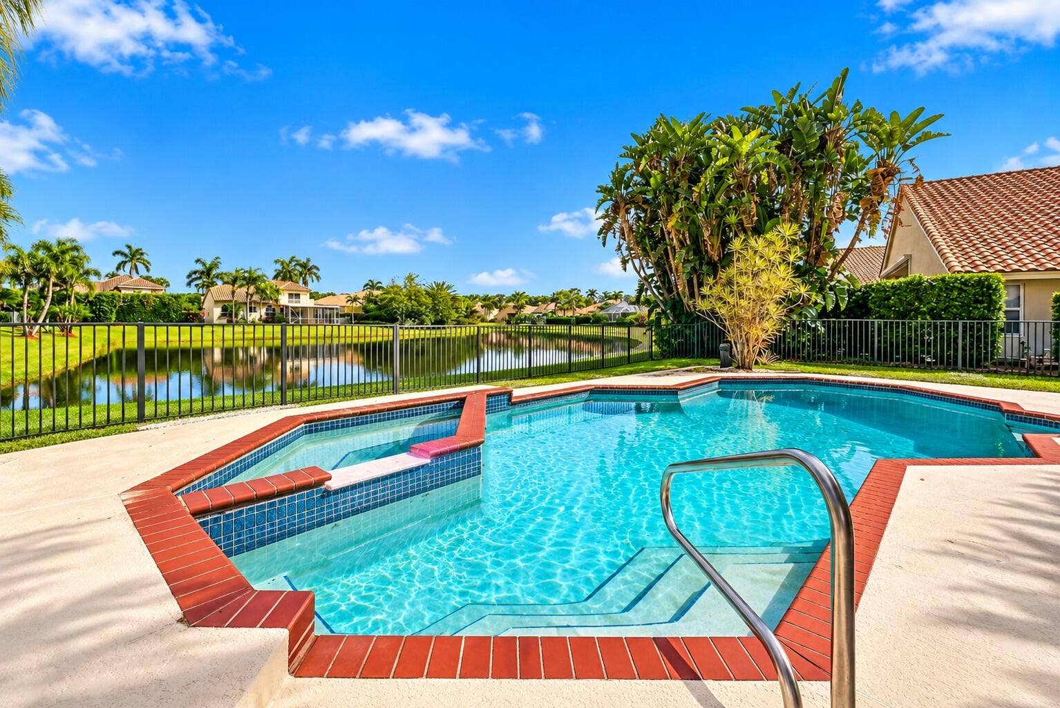 10671 St Thomas Drive, Boca Raton, FL 33498 Imagine spending your afternoons lounging poolside and your evenings unwinding in the spa, all while enjoying peaceful, unobstructed views of the lake.