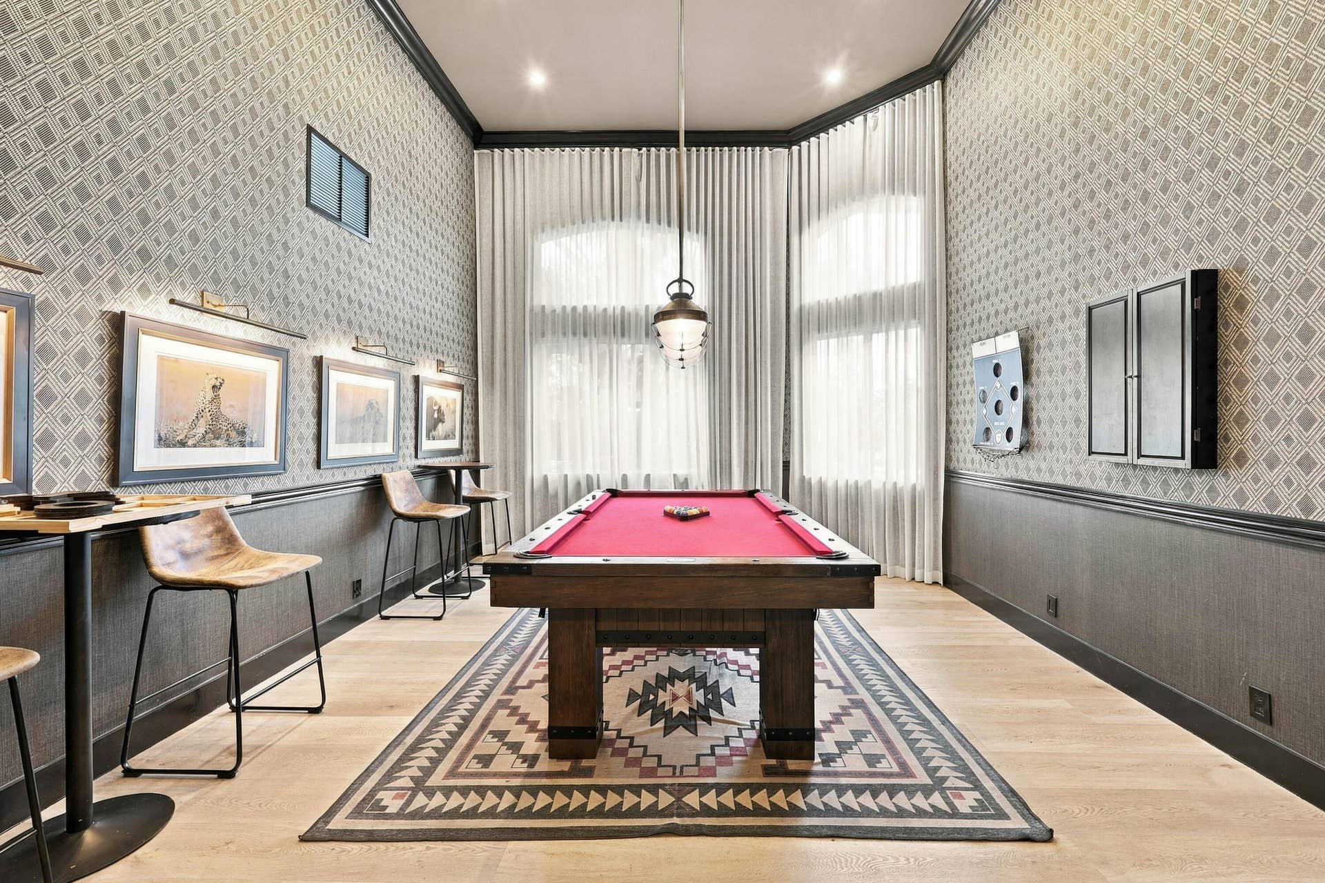 10671 St Thomas Drive, Boca Raton, FL 33498 Enjoy a friendly game of pool in the community's dedicated billiards room, featuring a full-size pool table, stylish finishes, and an inviting recreational atmosphere.